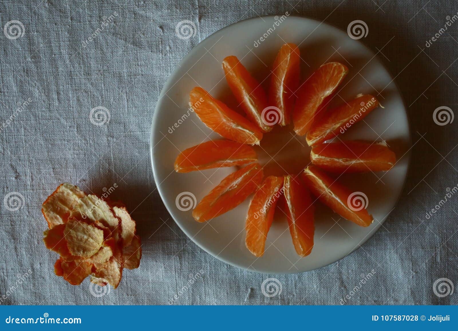 Eating mandarins stock photo. Image of shadows, zest 107587028