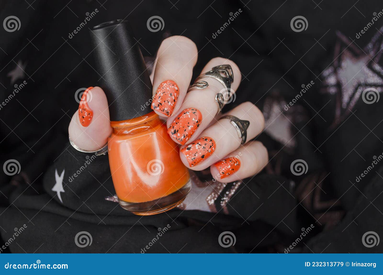 Orange matte nails on black blurry star background. Halloween nail art.  Stock Photo | Adobe Stock
