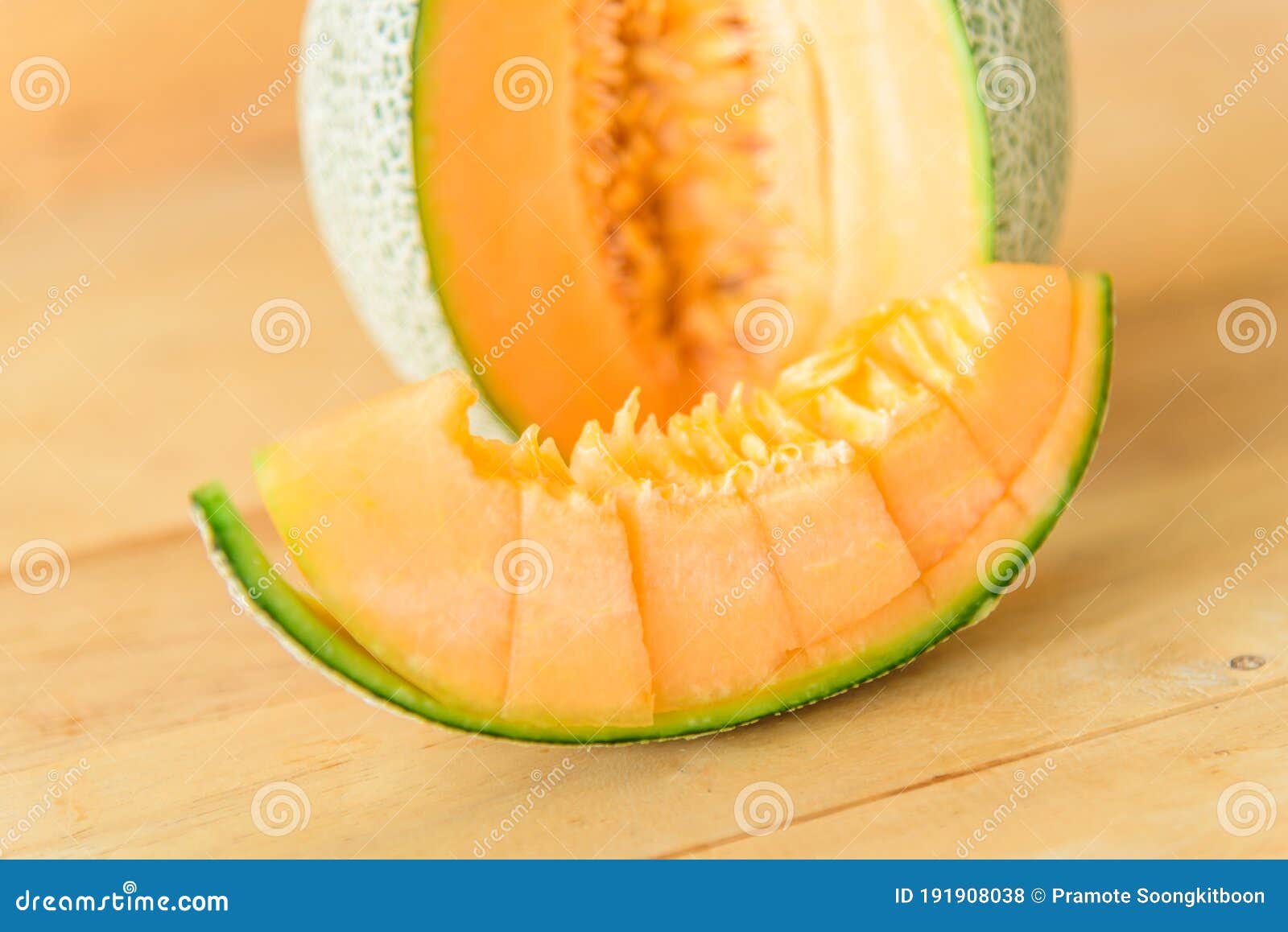Orange melon on wood plate stock photo. Image of organic 191908038