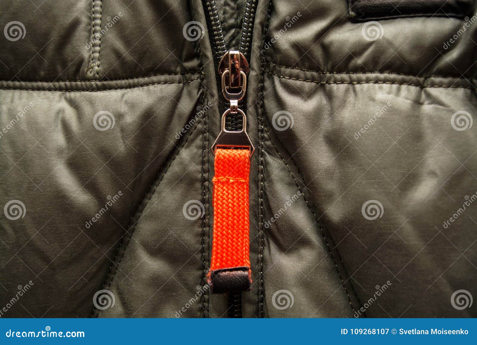 Orange Metal Zipper on a Green Jacket Stock Image - Image of connection ...