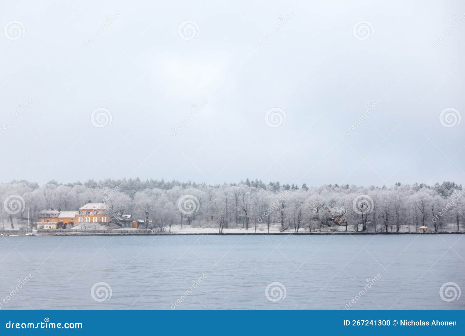 orange nedre manilla building in snow covered stockholm island of djurgÃ¥rden in winter fog