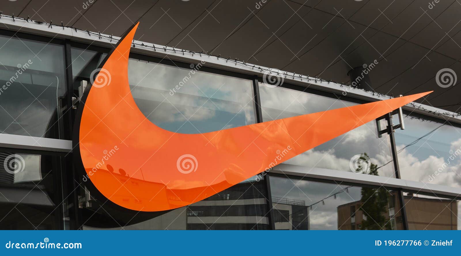 Orange Nike Logo on a Wall at an Official Nike Store Editorial Photo - Image of corporation
