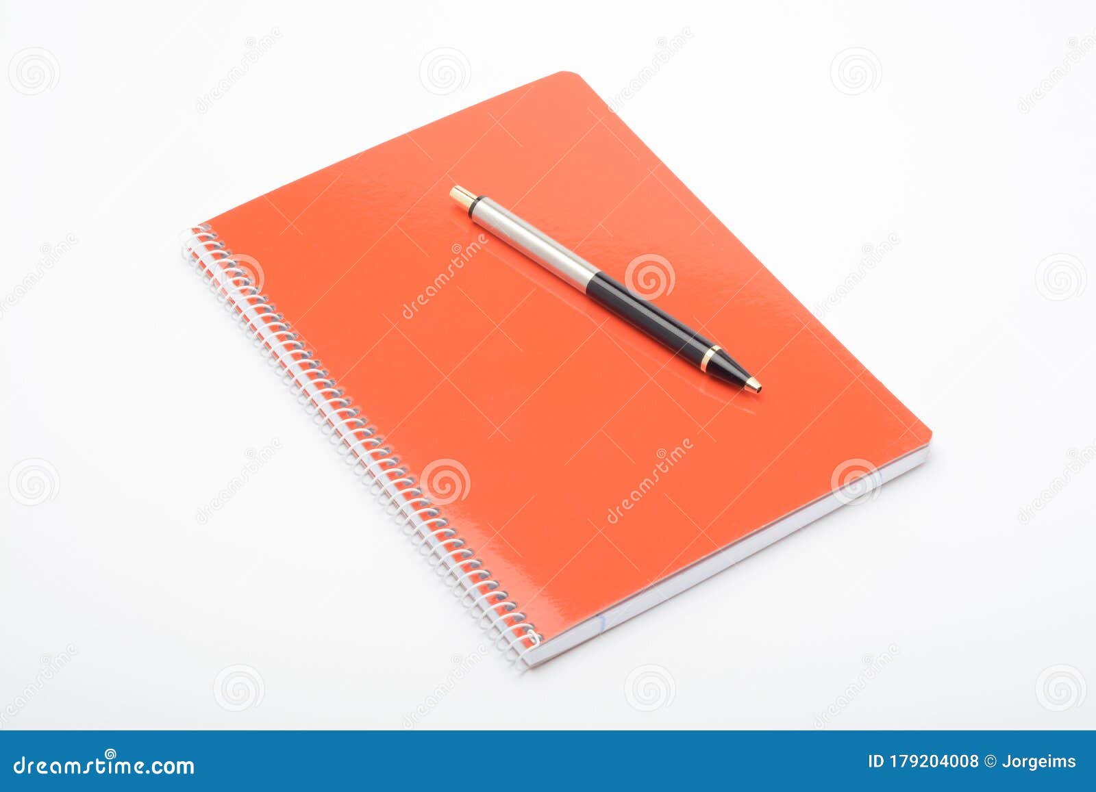 Sổ tay cam và bút ảnh stock là sự kết hợp tuyệt vời giữa style và sự tiện dụng. Hãy xem hình để thấy được sự trau chuốt và độc đáo của sản phẩm này!