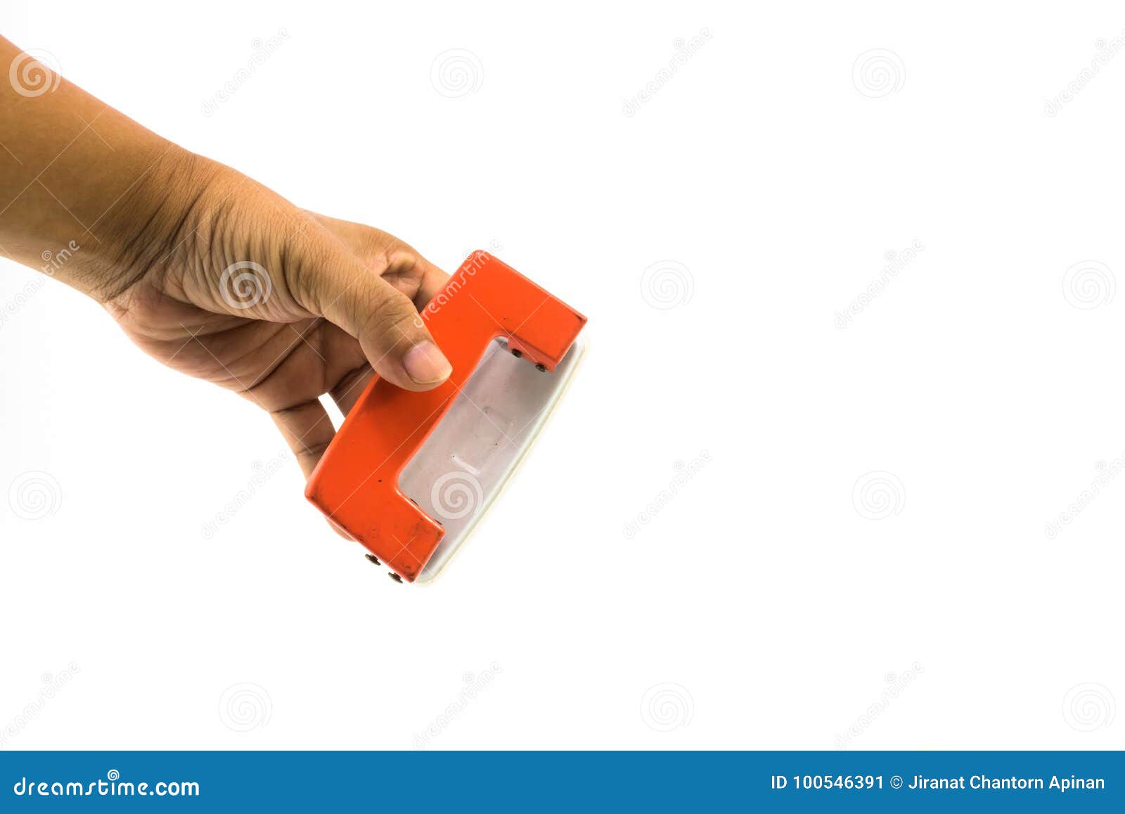 An Orange Paper Punch on the Hand of Man Isolated Stock Image Image of isolated, hole 100546391