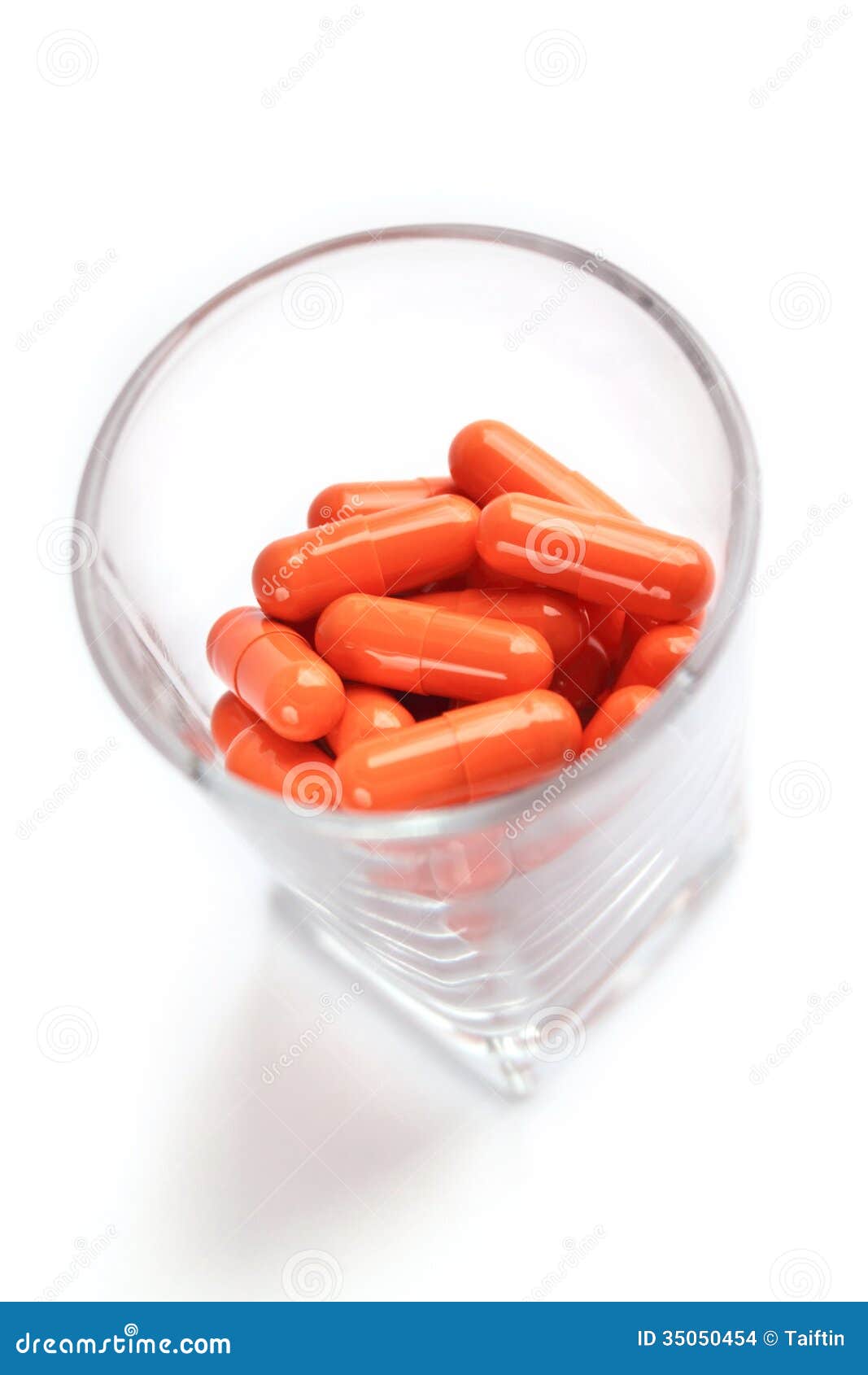 Orange Pill Capsules in Glass Stock Photo Image of gelatin