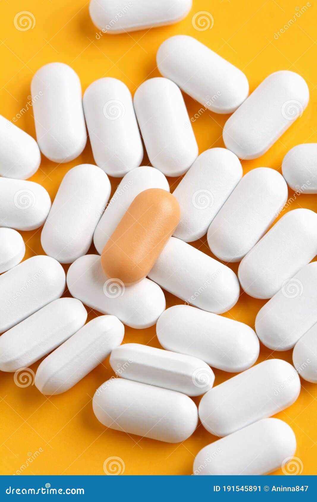 Orange pill among white stock image. Image of pharmaceutics 191545891