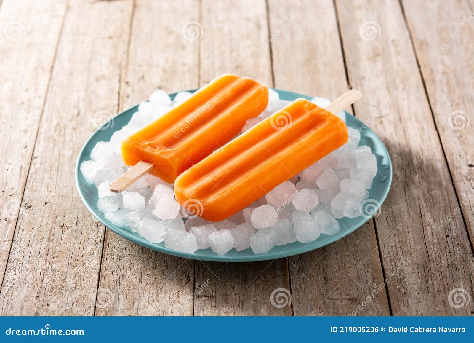 Orange Popsicles on Blue Plate Stock Photo Image of orange, vegan 219005206