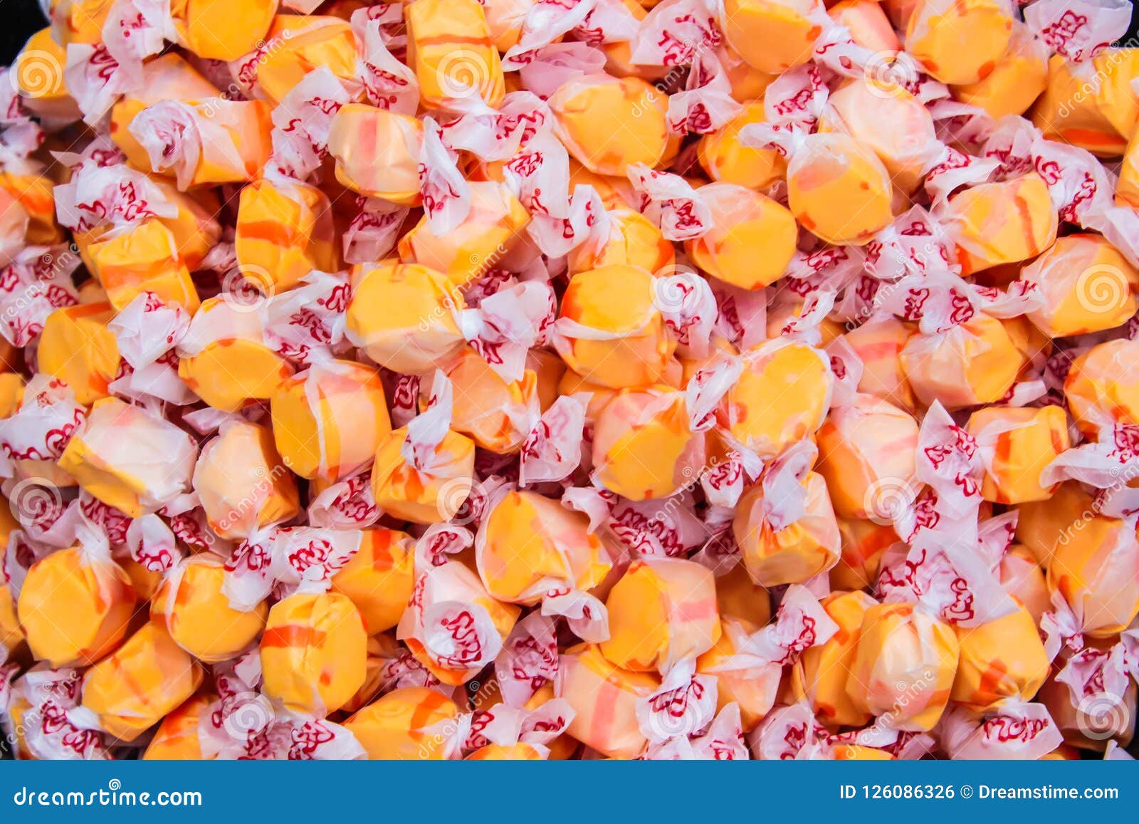 Orange and Red Wrapped Candy Stock Photo Image of background, candies