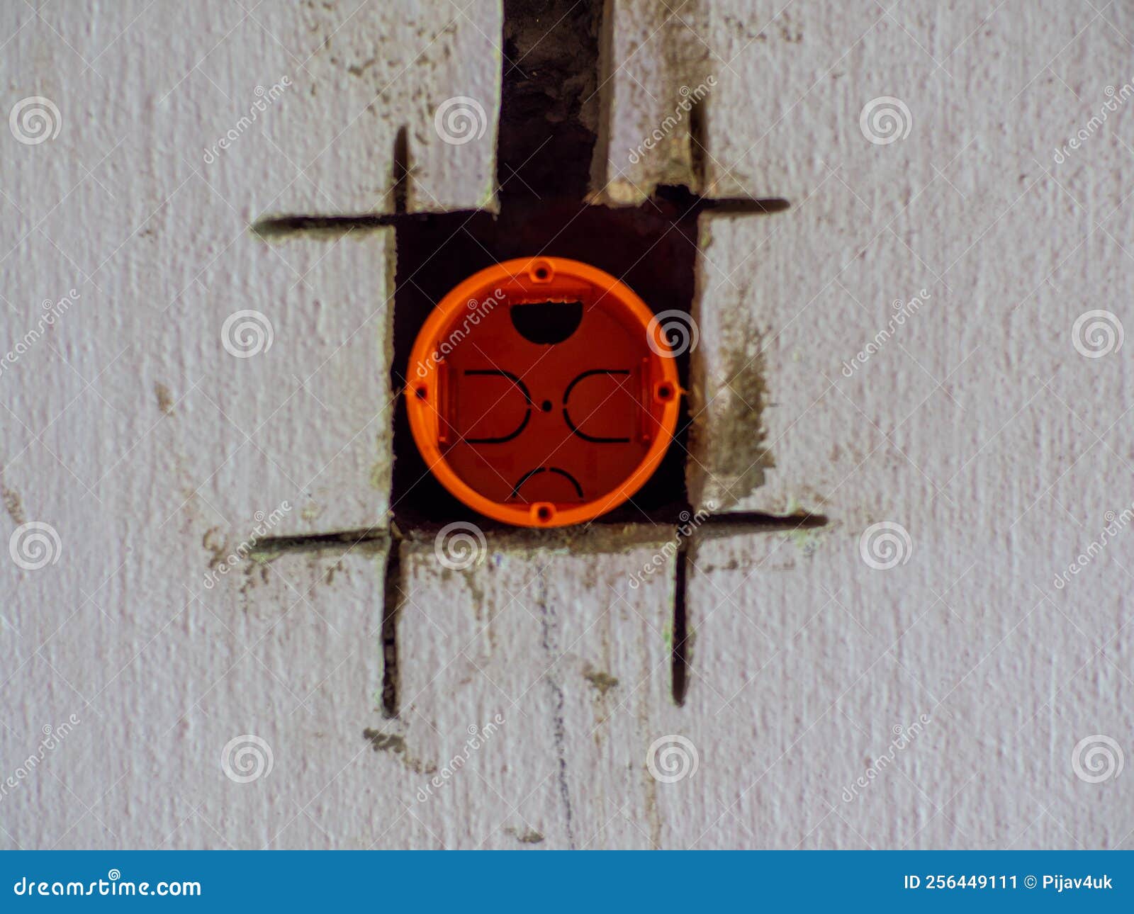 Plastic Backbox for Socket or Switch Inserted into the Drilled Hole on