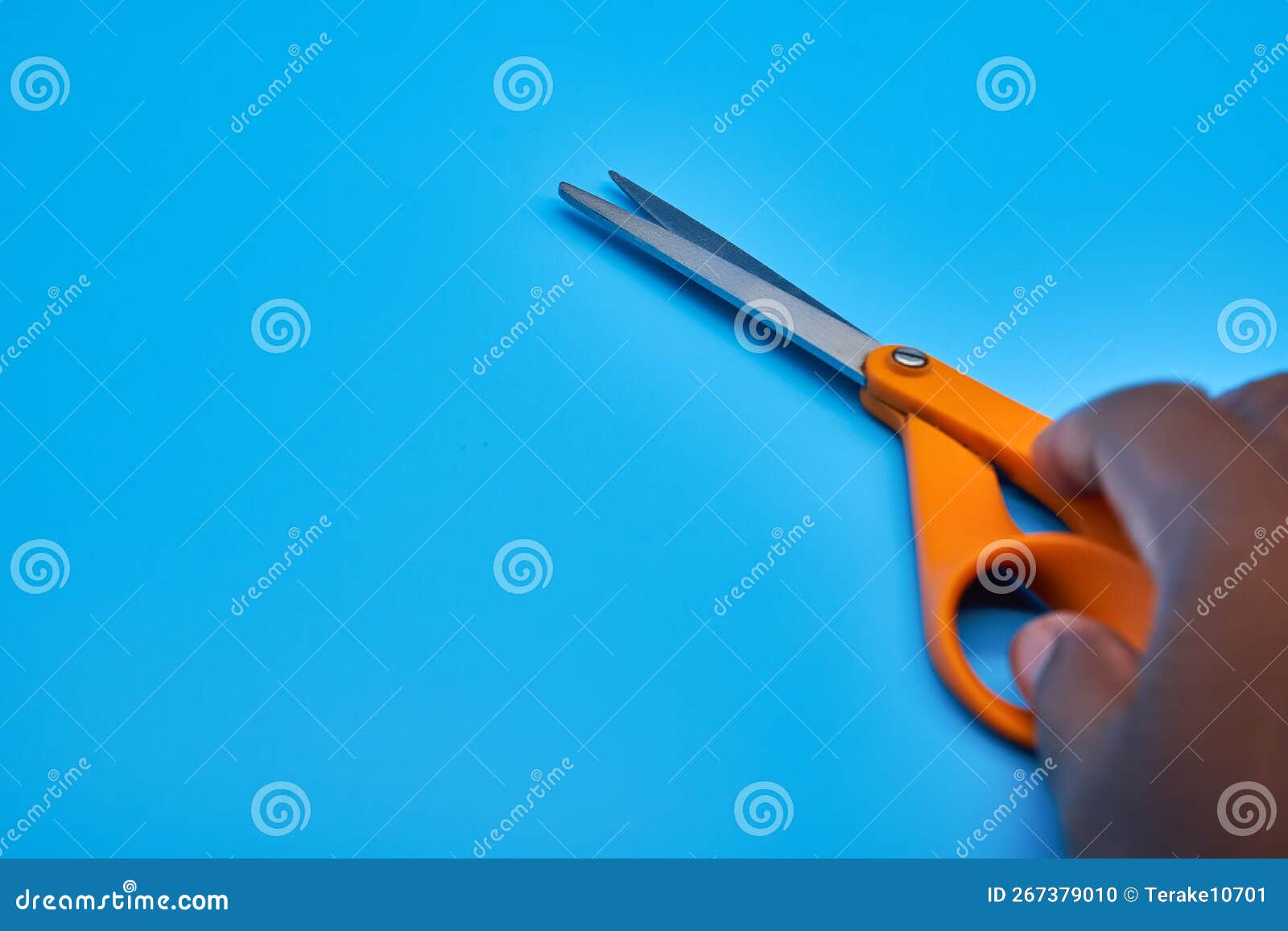 Orange Shear Scissors on a Light Blue Background Cutting Shears Stock