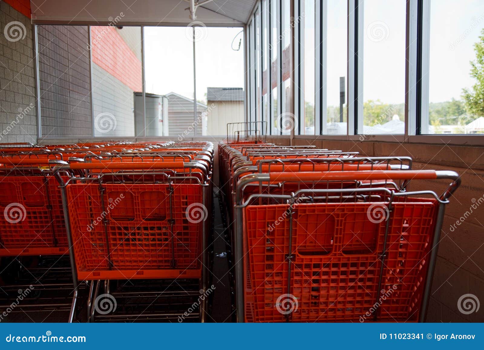 Orange shopping carts stock image. Image of cart, orange 11023341
