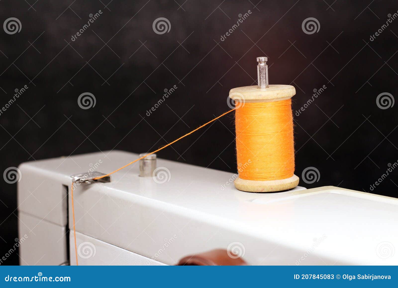 Orange Thread Spool on a Sewing Machine Stock Image Image of silk