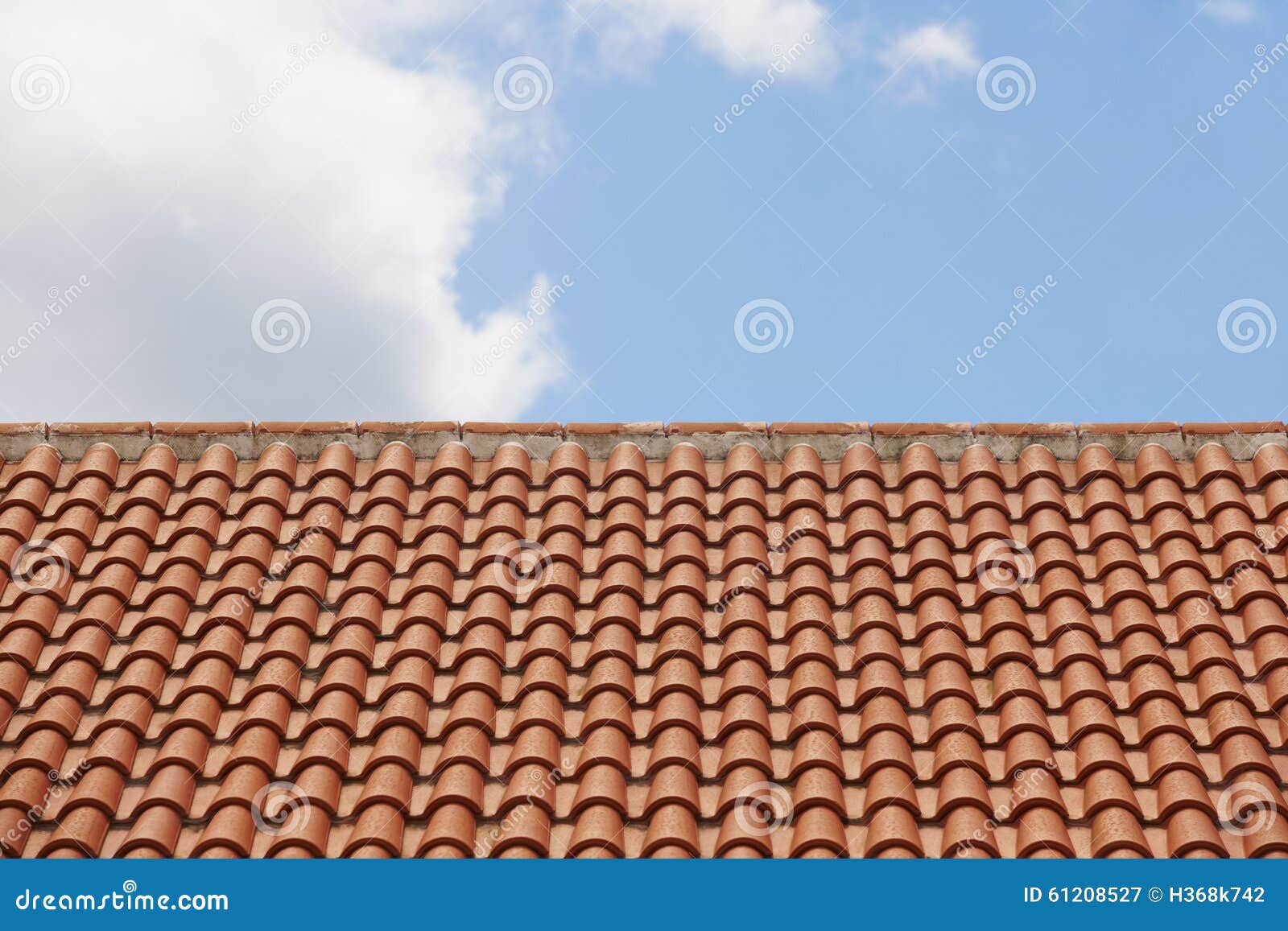 Orange Tile Roof Over a Blue Sky Stock Image - Image of roofs, exterior