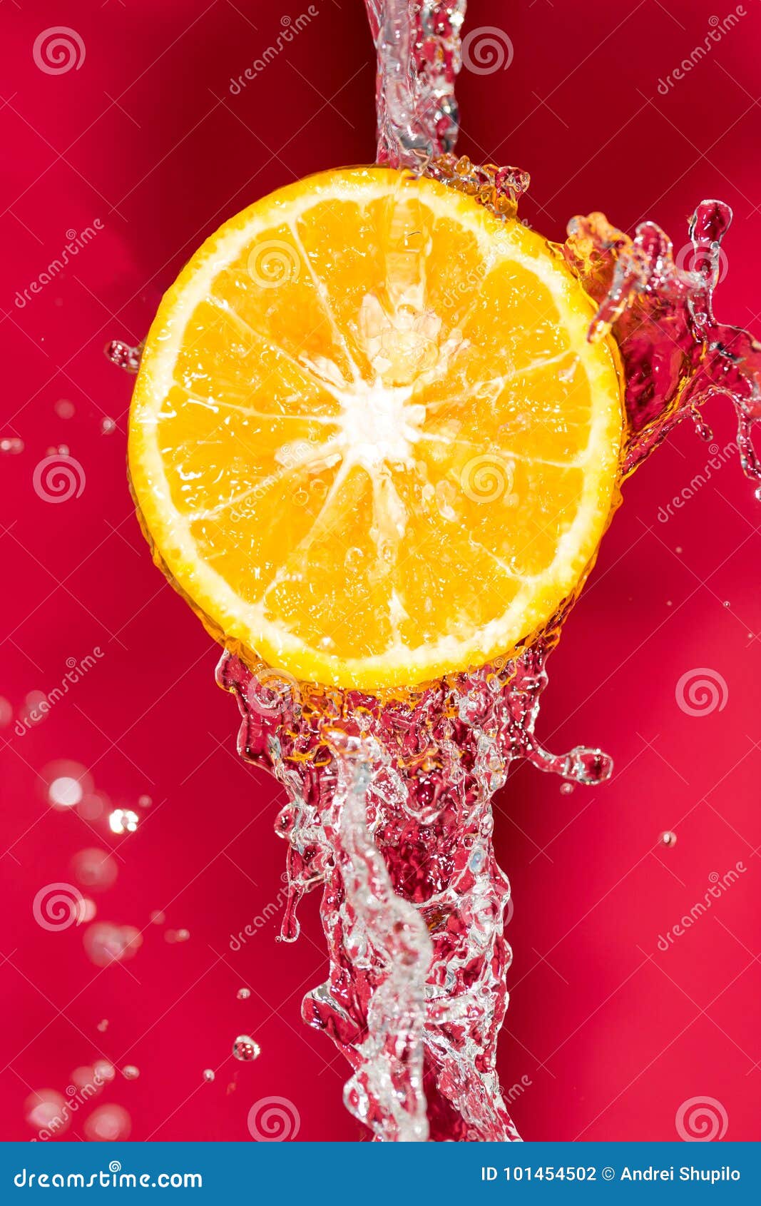 Orange in Water on a Red Background Background Stock Photo Image of