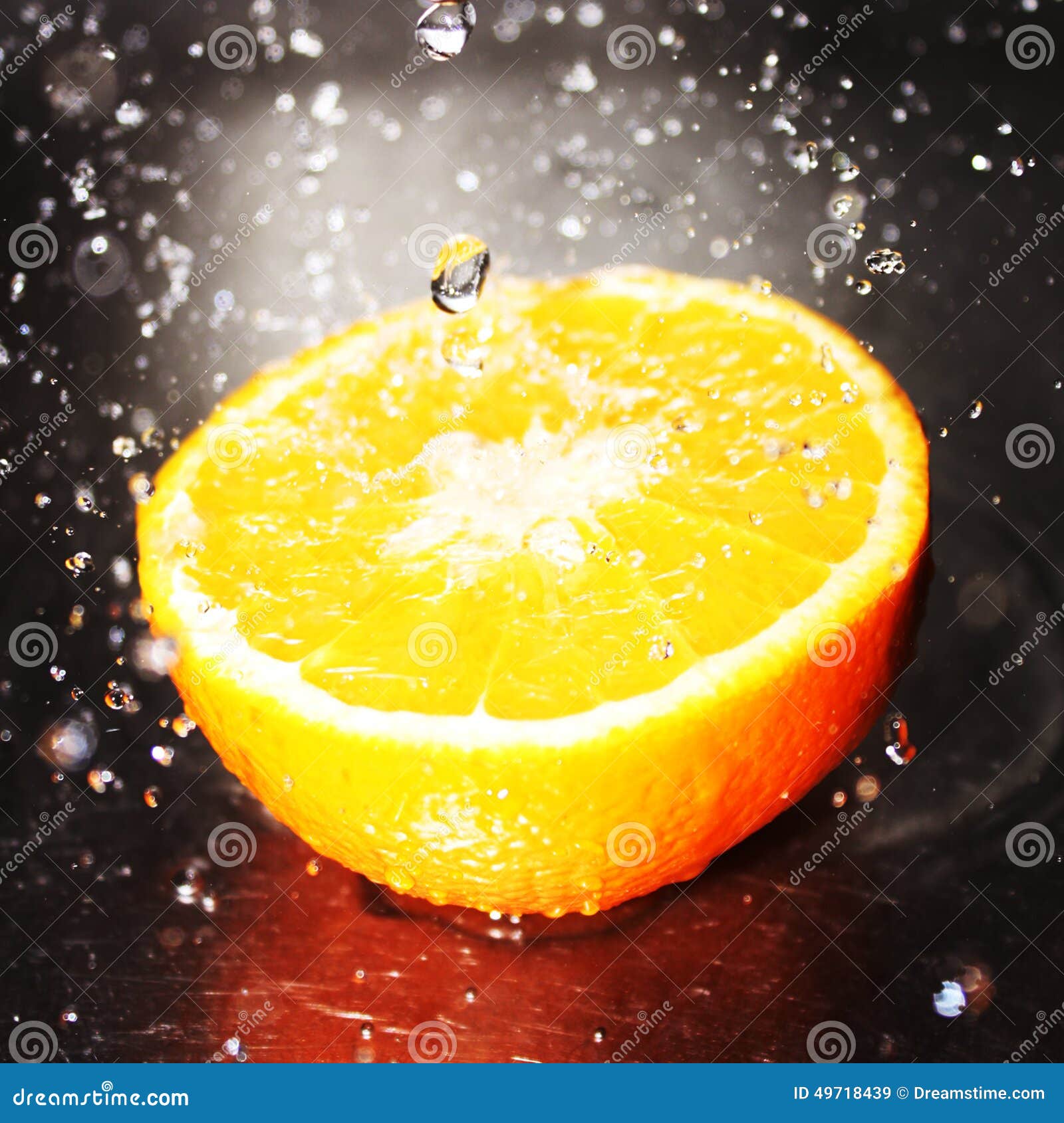 Orange with water splash stock image. Image of contrast 49718439