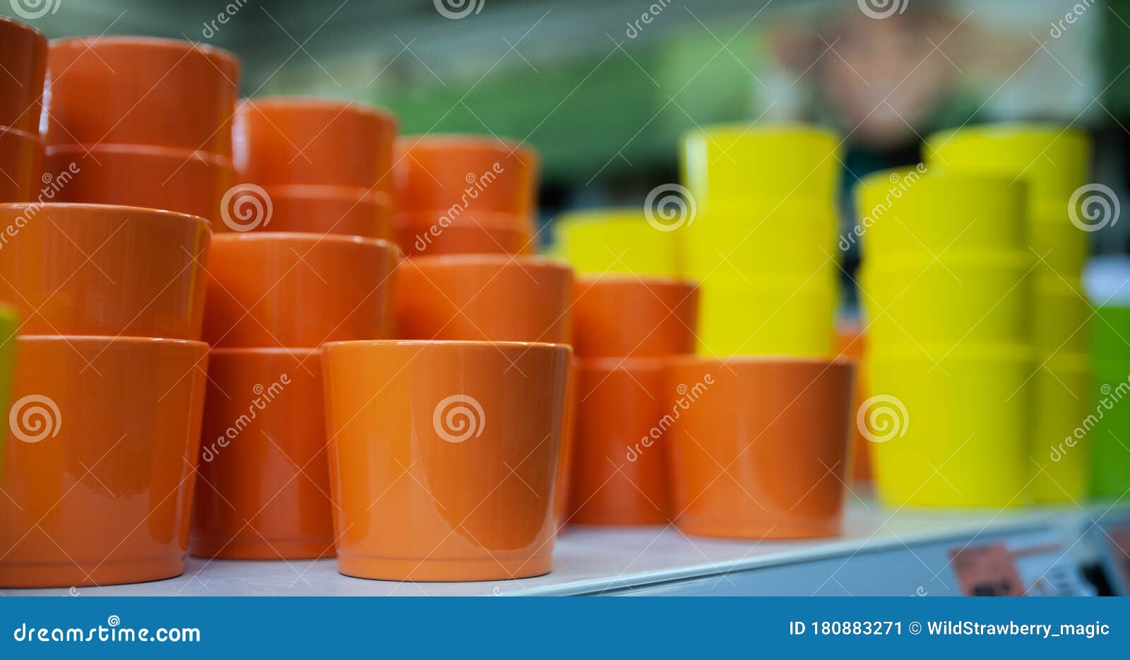 Orange and Yellow Flower Pots on the Counter in the Store Stock Image