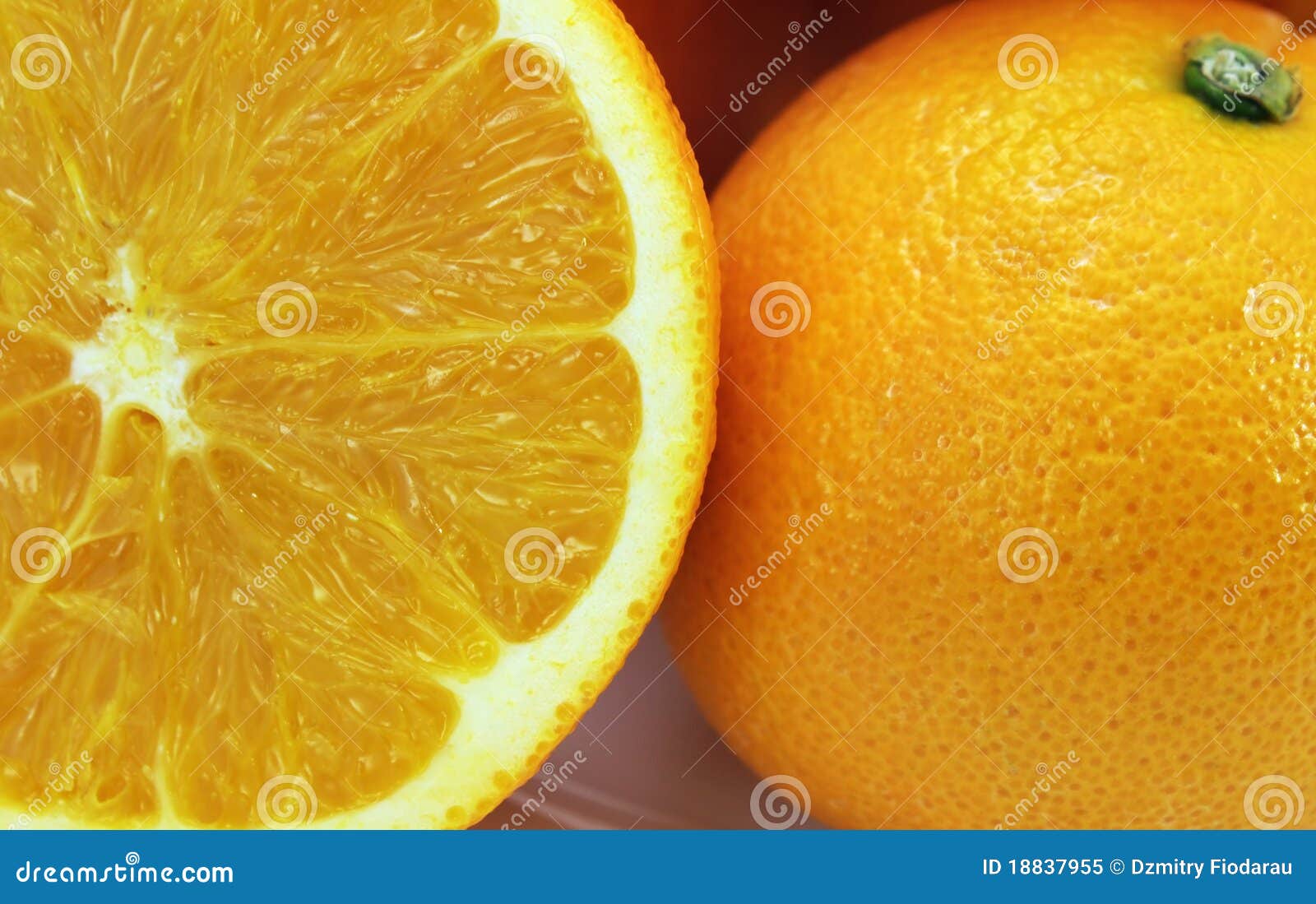 Oranges whole and cut on a half. Macro