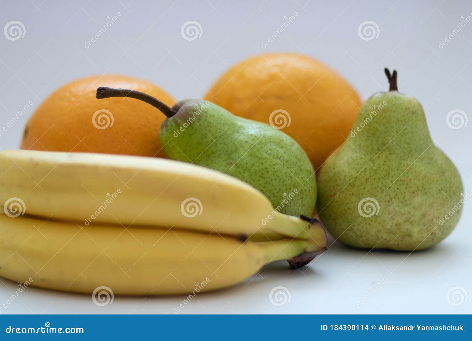 Oranges, Pears and Bananas on a White Isolated Background Stock Photo