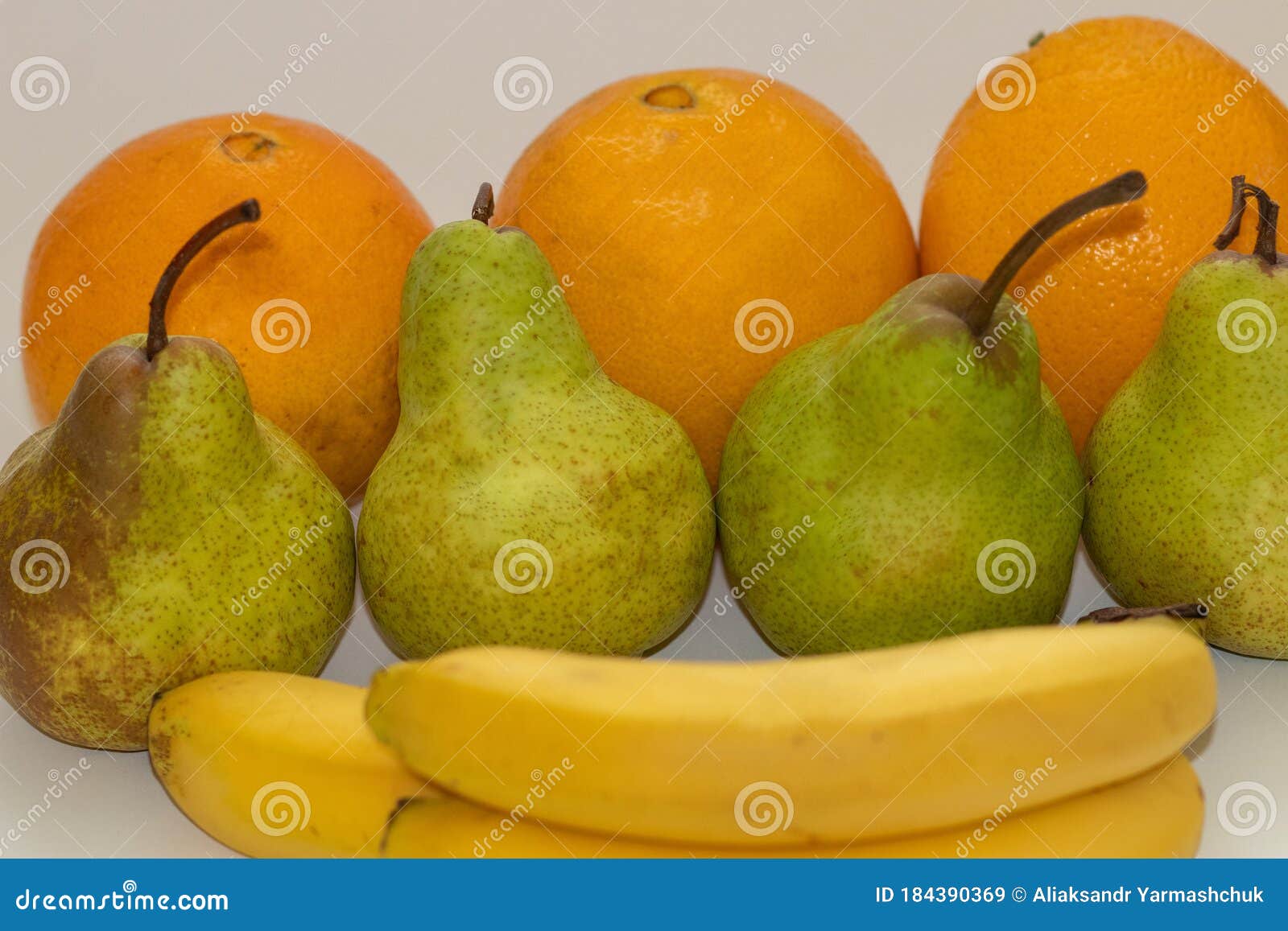 Oranges, Pears and Bananas on a White Isolated Background Stock Image