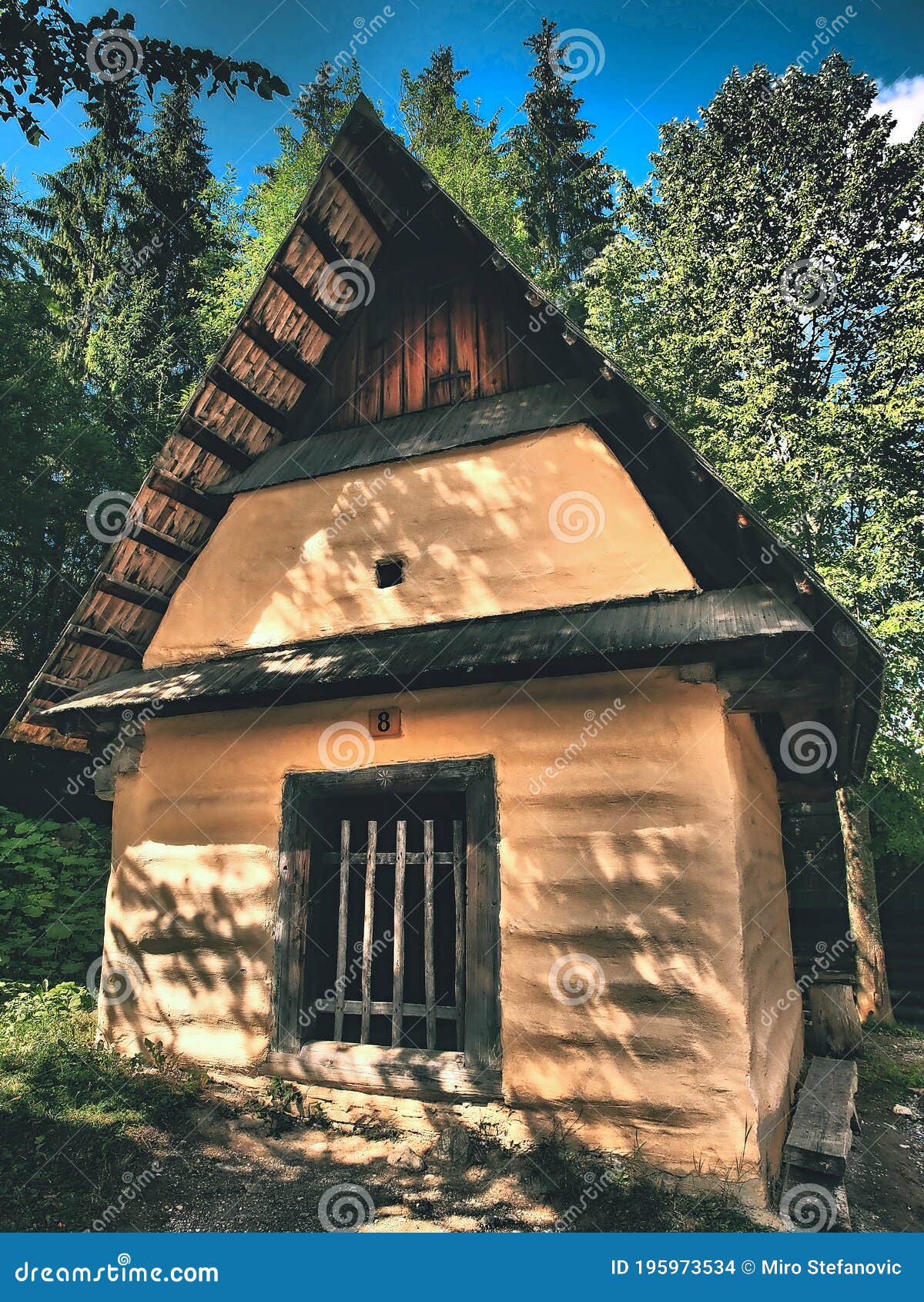 beautifully old wooden houses in beautiful nature full of trees and flowers.slovakia