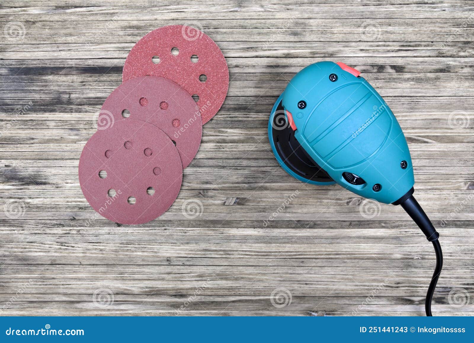 Orbital Sander Machine with Sanding Discs on Wooden Background Stock