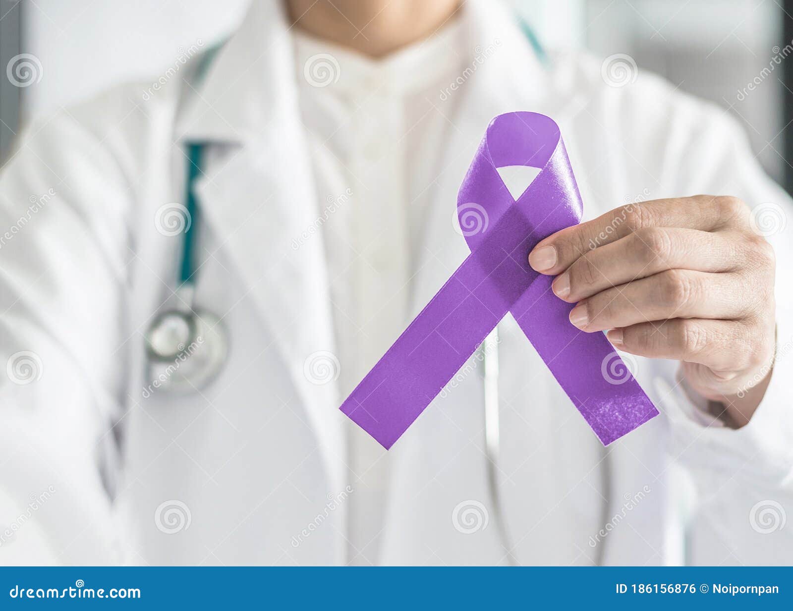 orchid purple lavender ribbon awareness in doctorÃ¢â¬â¢s hand for (all kinds cancers), testicular cancer awareness