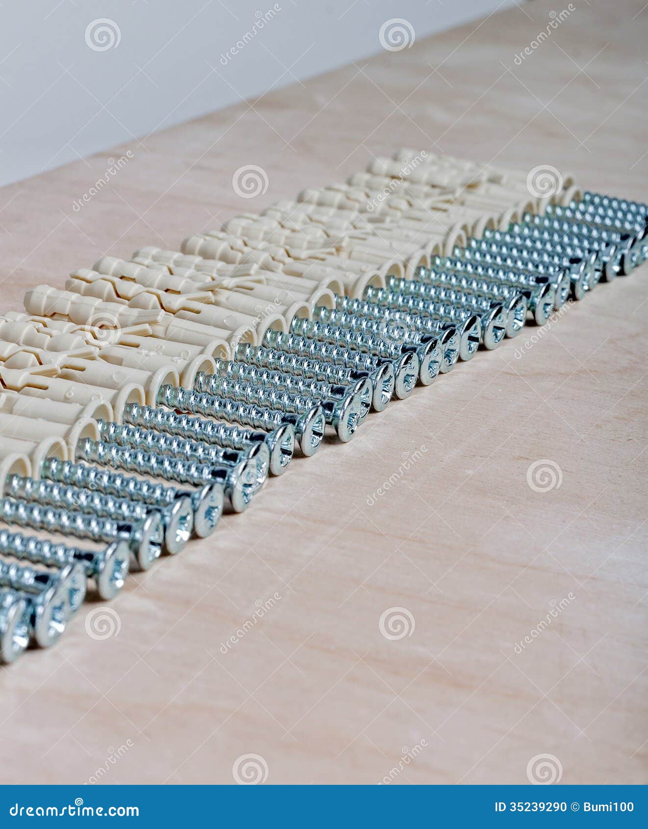 Ordered Series of Screws and Plugs on Plywood Stock Photo Image of