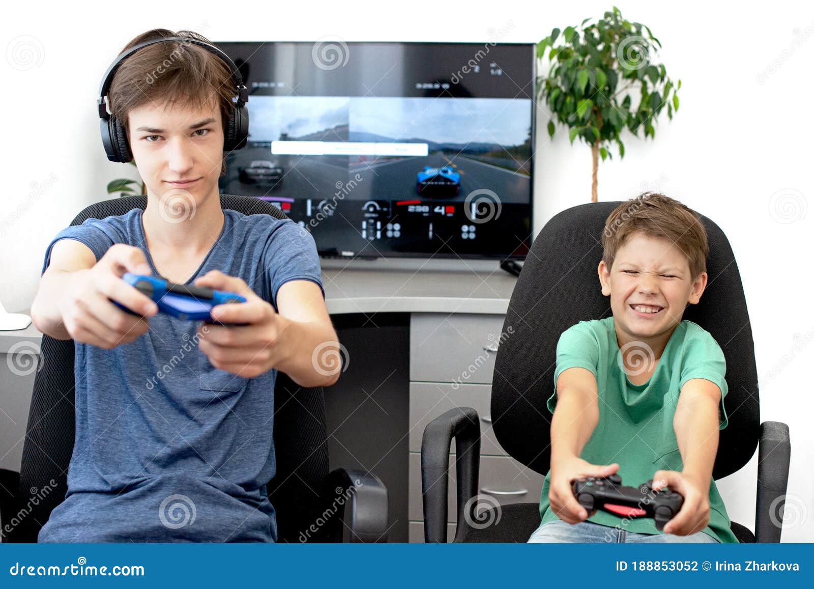 Teenager Boy Online Plays A Computer Game With Headphones And A