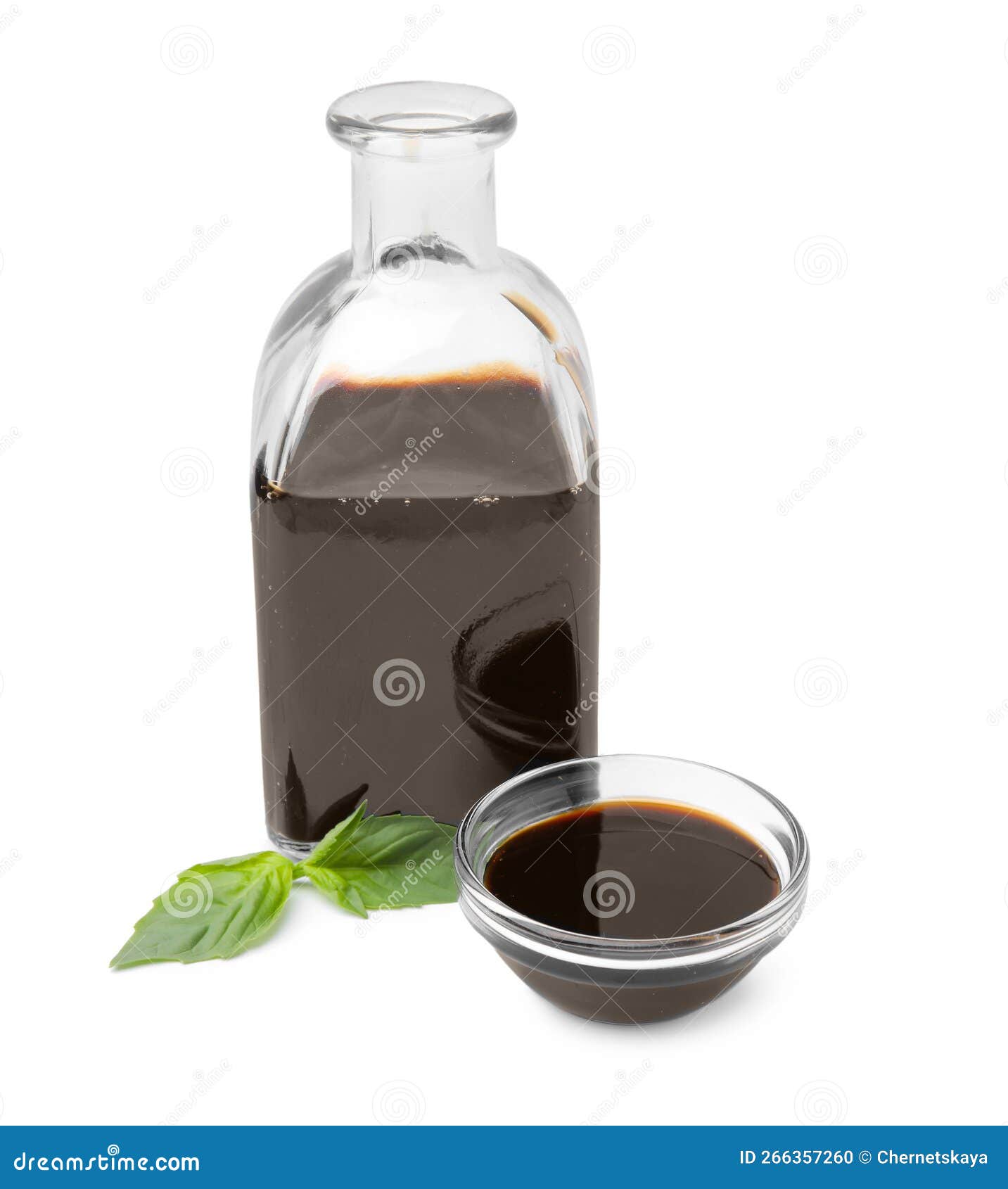 Organic Balsamic Vinegar and Basil Isolated on White Stock Photo