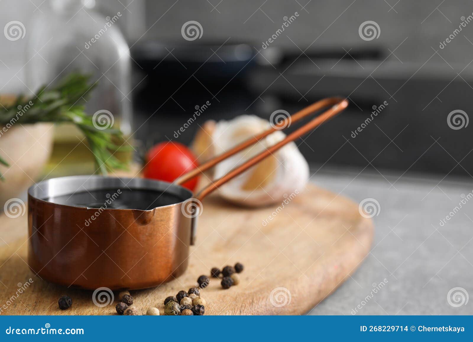 Organic Balsamic Vinegar and Cooking Ingredients on Grey Table. Space for Text Stock Photo