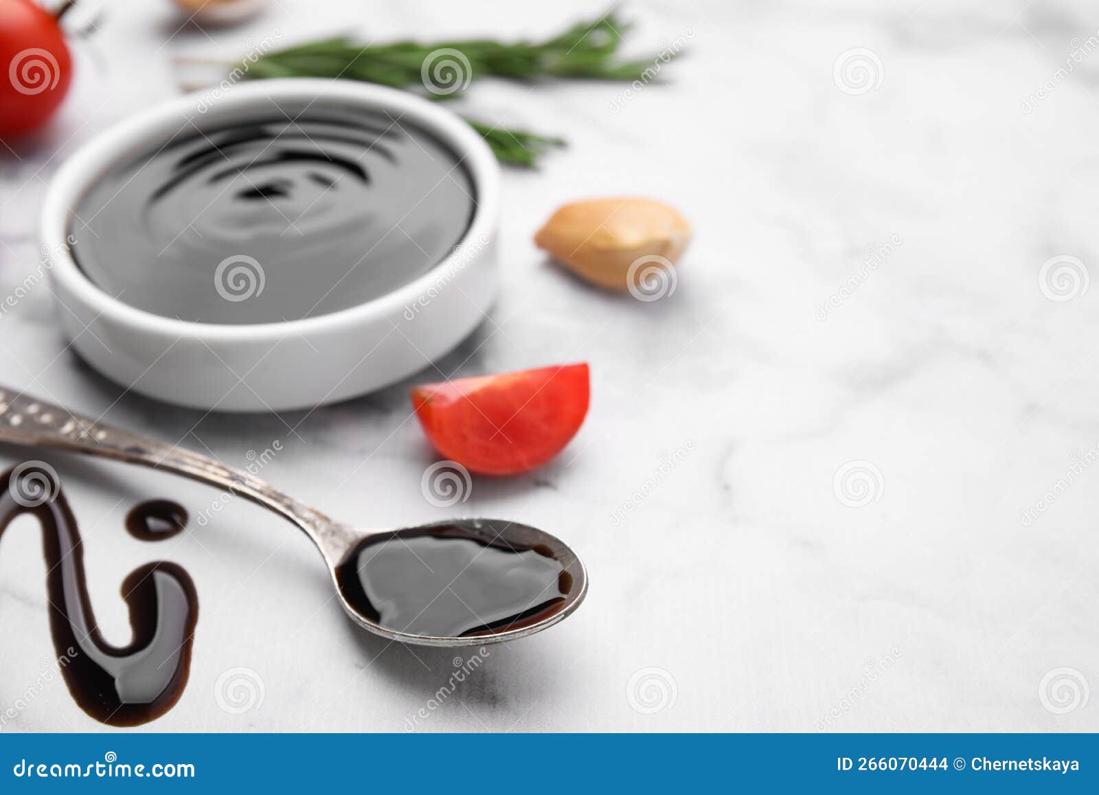 Organic Balsamic Vinegar and Cooking Ingredients on White Marble Table, Closeup. Space for Text