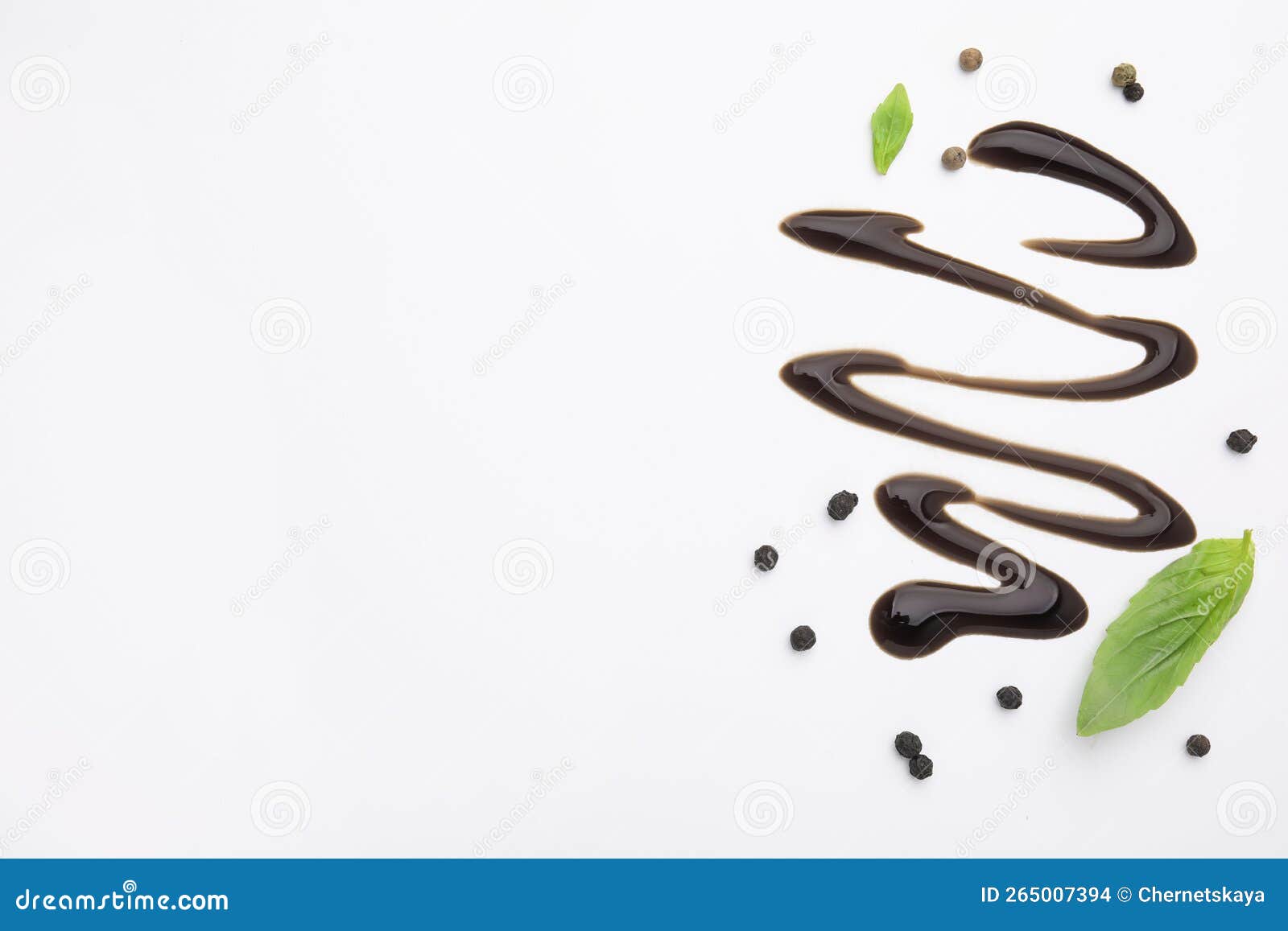 Organic Balsamic Vinegar, Peppercorns and Basil Leaves on White