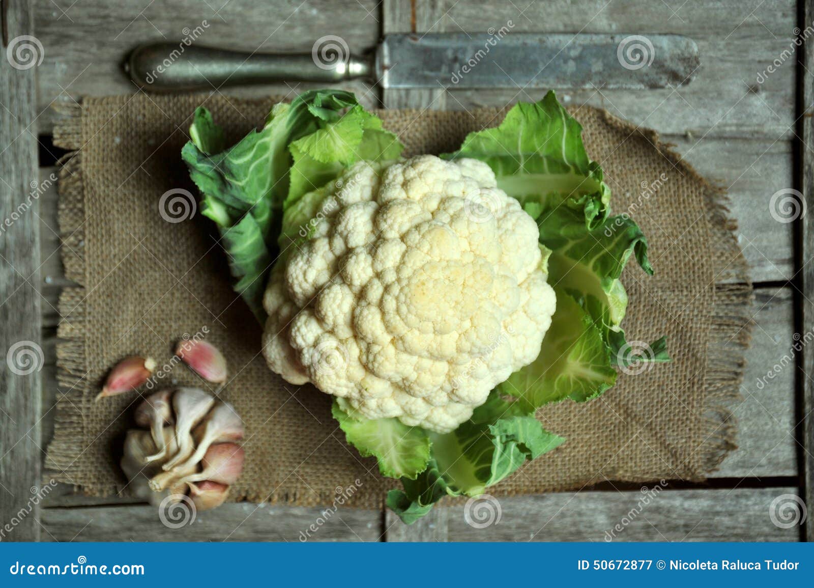 organic cauliflower and garlic on a vintage background