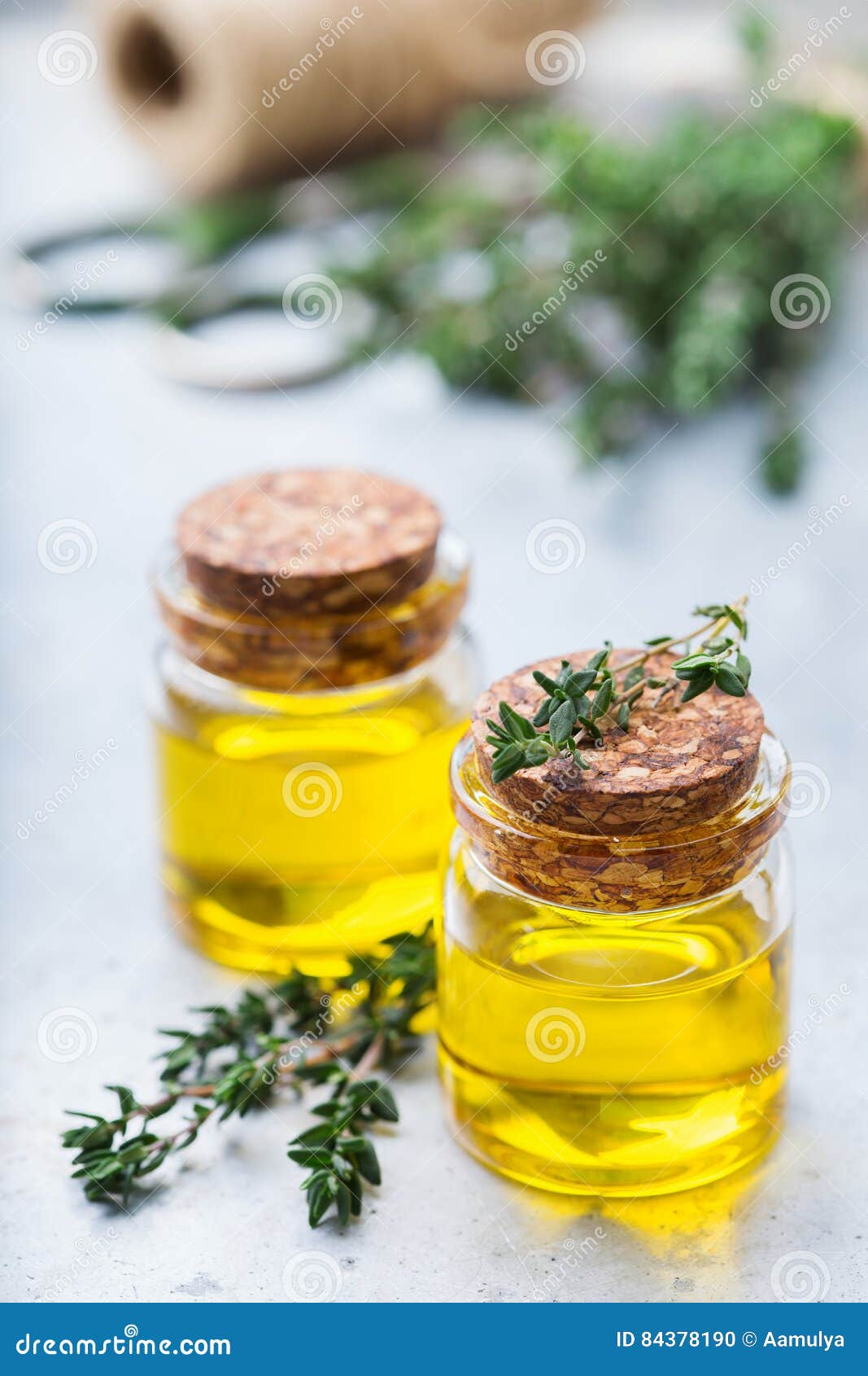 Organic Essential Thyme Oil With Green Leaves Stock Photo - Image of