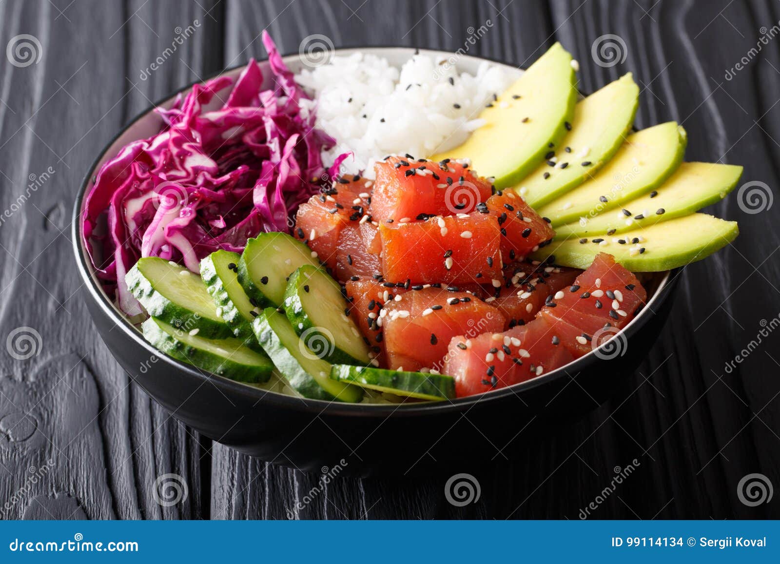 organic food: tuna poke bowl with rice, fresh cucumbers, red cab