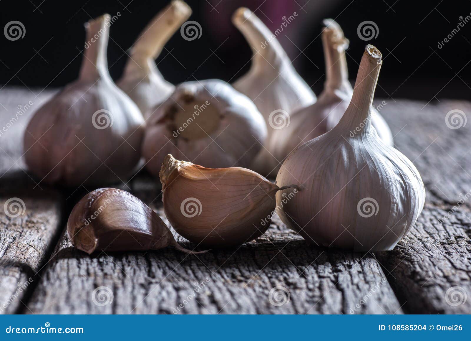 Organic Garlic Whole And Cloves On The Wooden Background Stock Photo