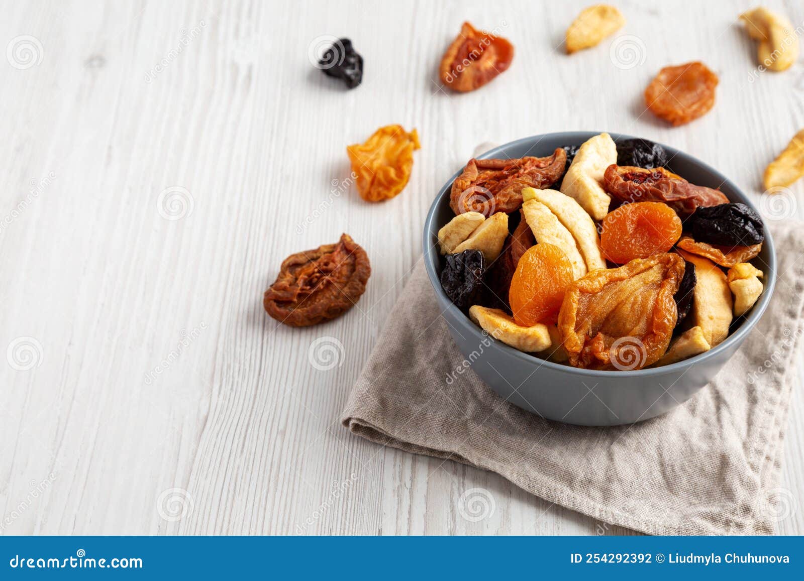 Organic Healthy Fruit Mix in a Bowl, Side View. Copy Space Stock Photo
