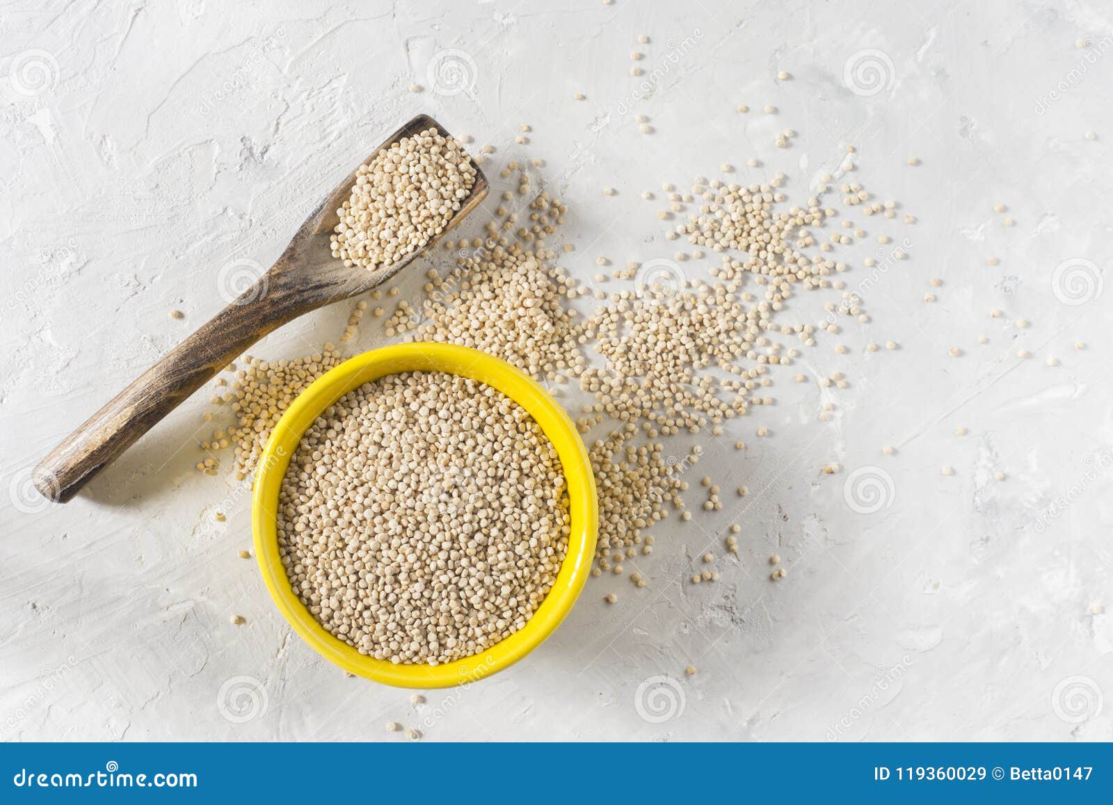 organic quinua cereal in color bowl on white background