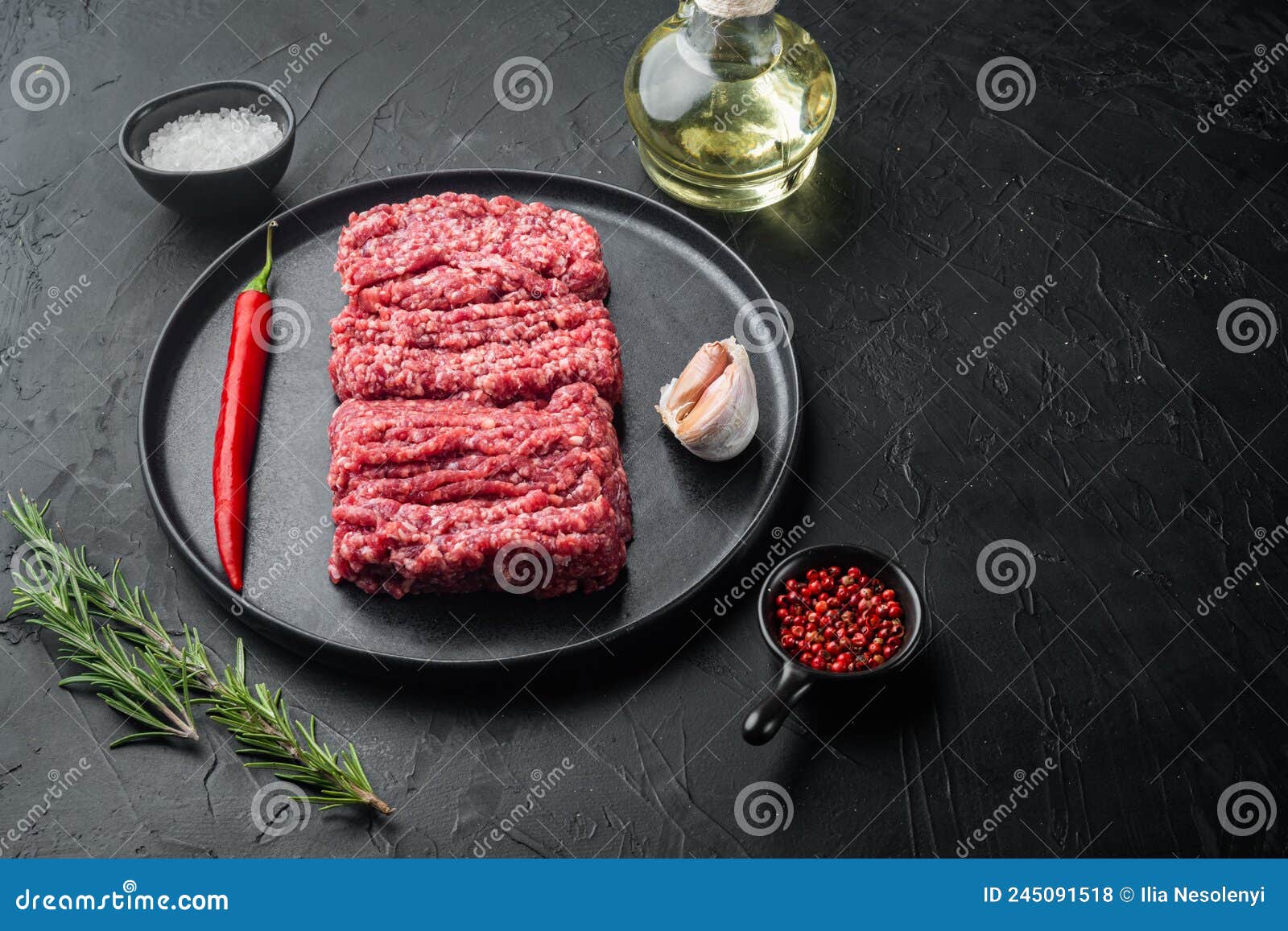 Organic Raw Grass Fed Ground Beef, on Black Background with Copy Space