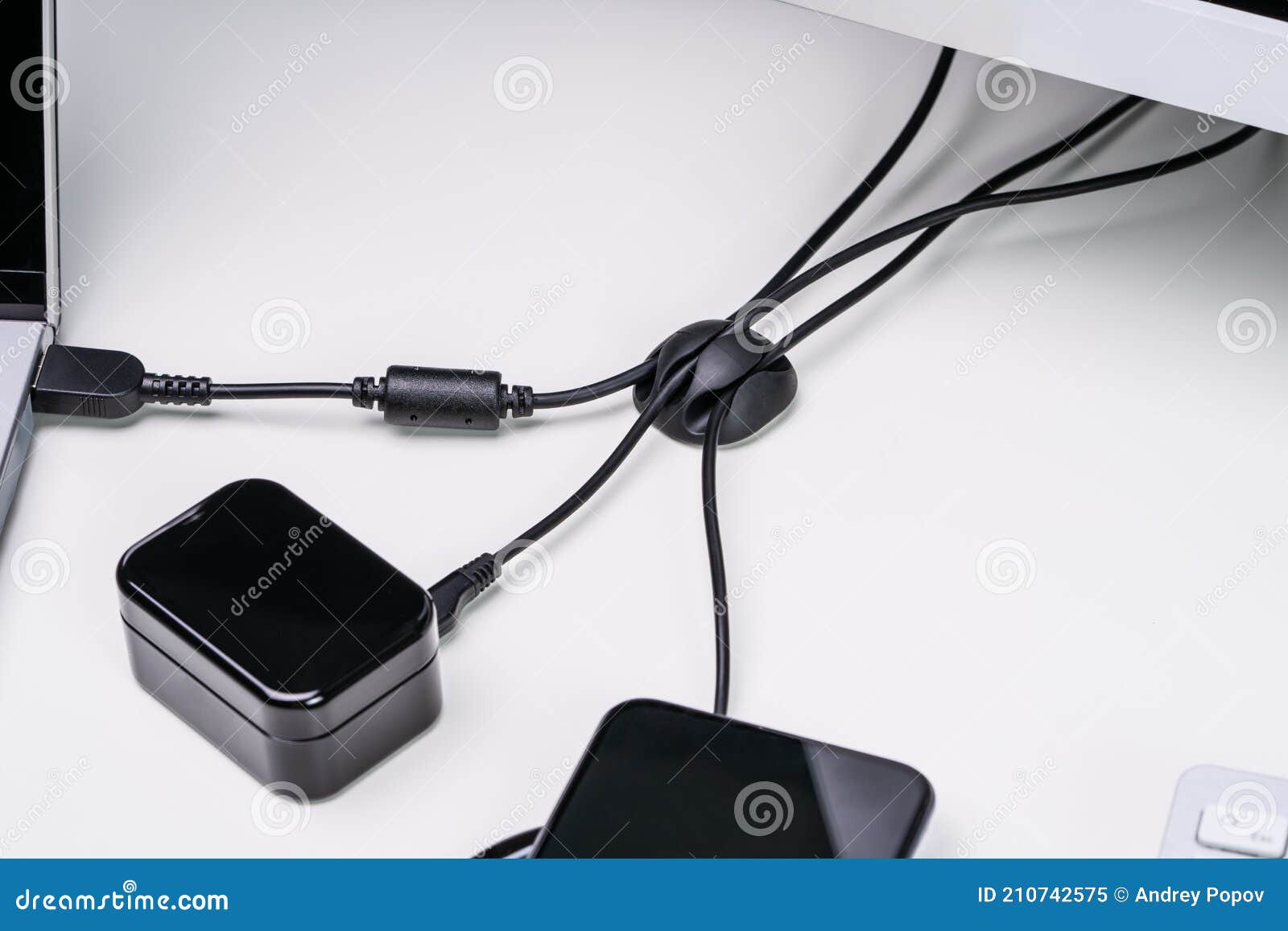 Organized Cable Holder on Table with Charging Cables Stock Image