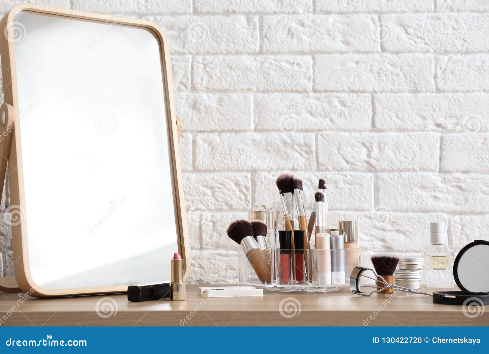 Organizer With Cosmetic Products For Makeup On Table Stock Photo