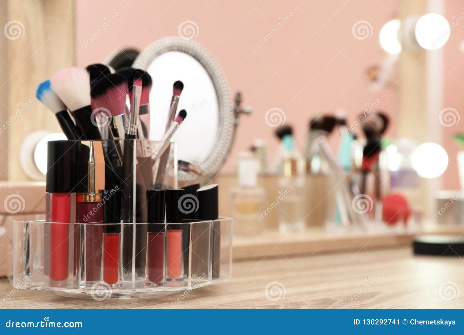Organizer With Cosmetic Products For Makeup On Table Near Mirror