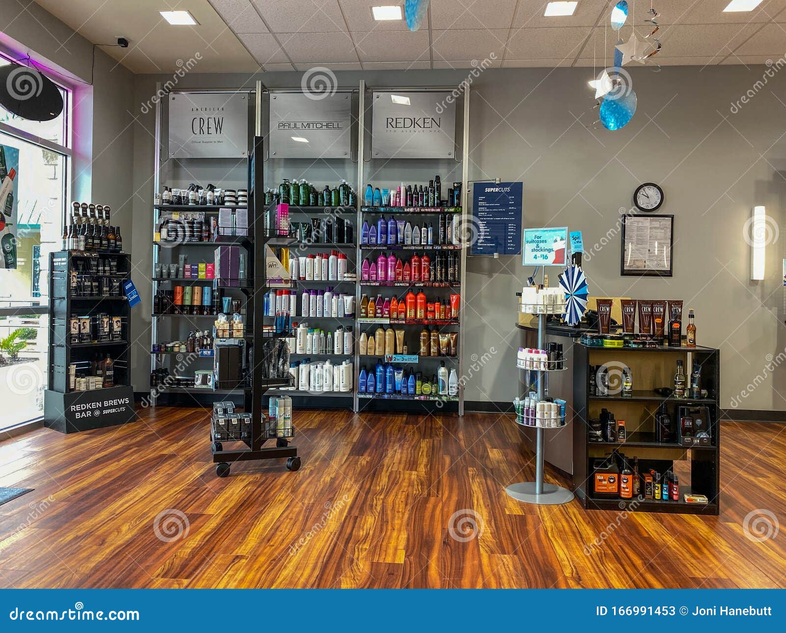 The Interior Of A Supercuts Hair Salon With Hair Products For Sale