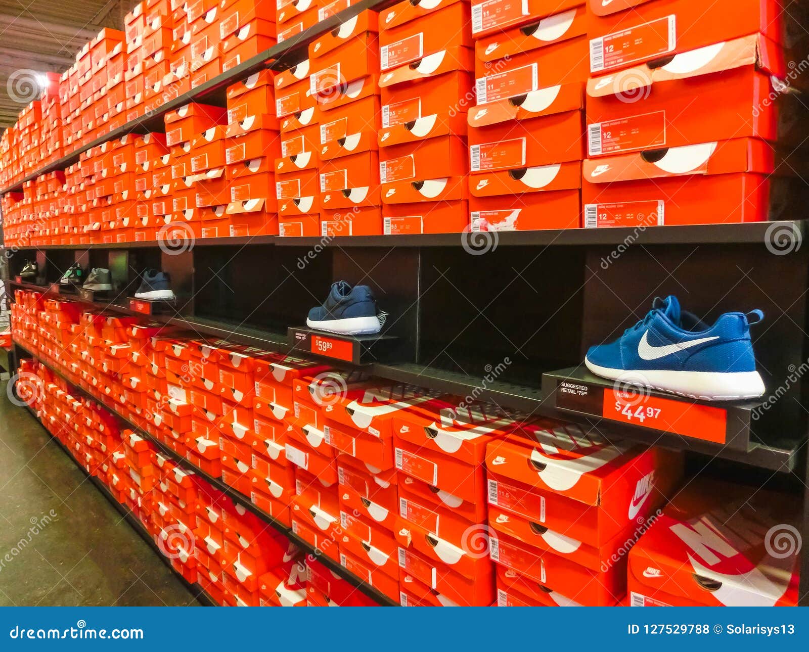 USA - May 8, 2018: Background of Stacked Nike Shoes Boxes at Orlando Premium Outlet at Orlando, USA Editorial Stock Photo - of background, orange: 127529788