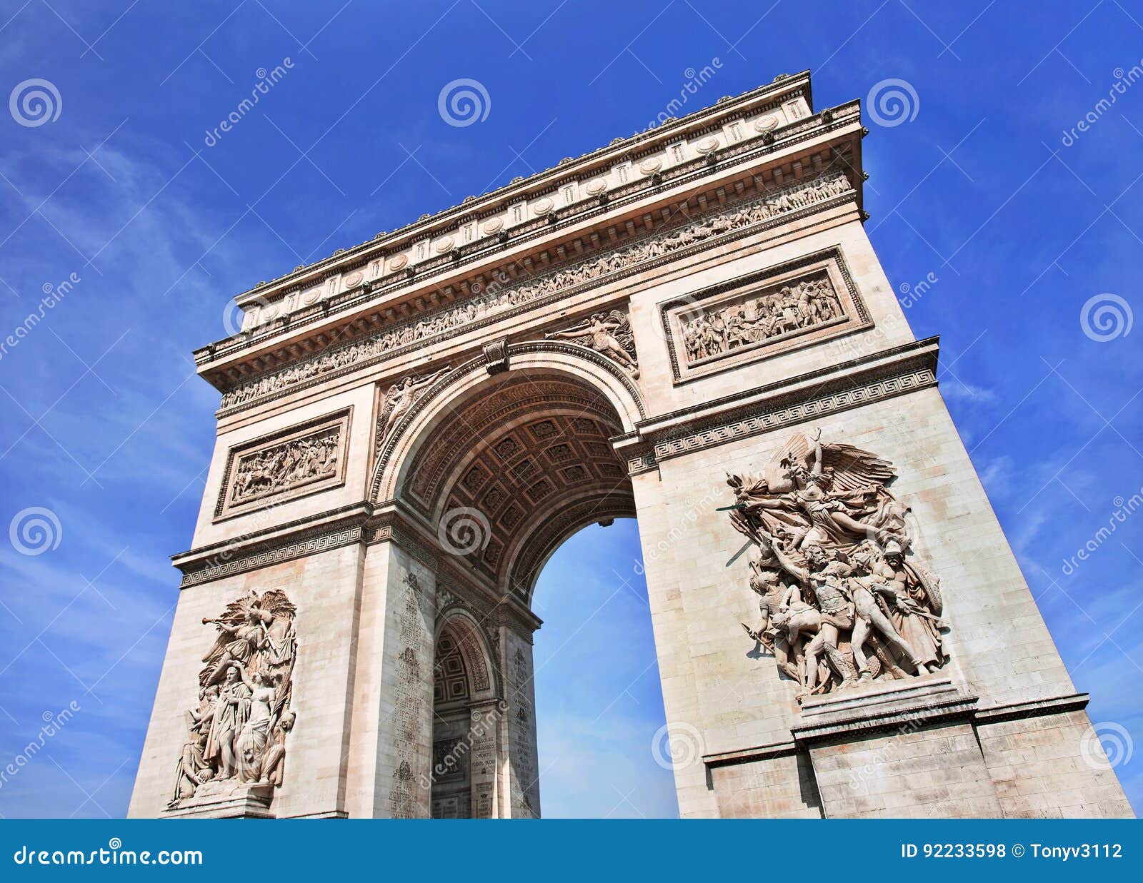 the ornate arce de triomphe against a blue sky, paris, france