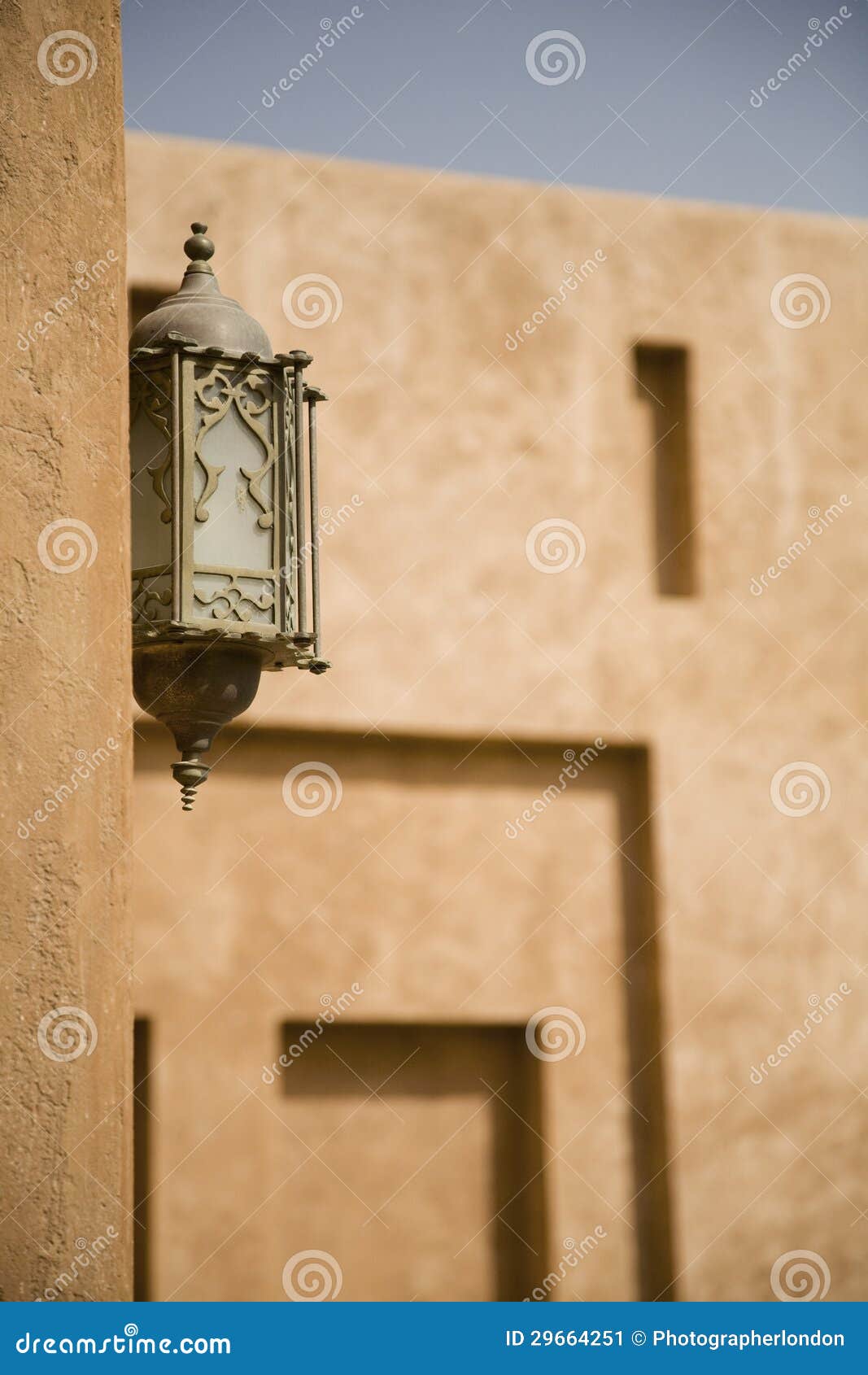 ornate lantern on al ain palace museum wall