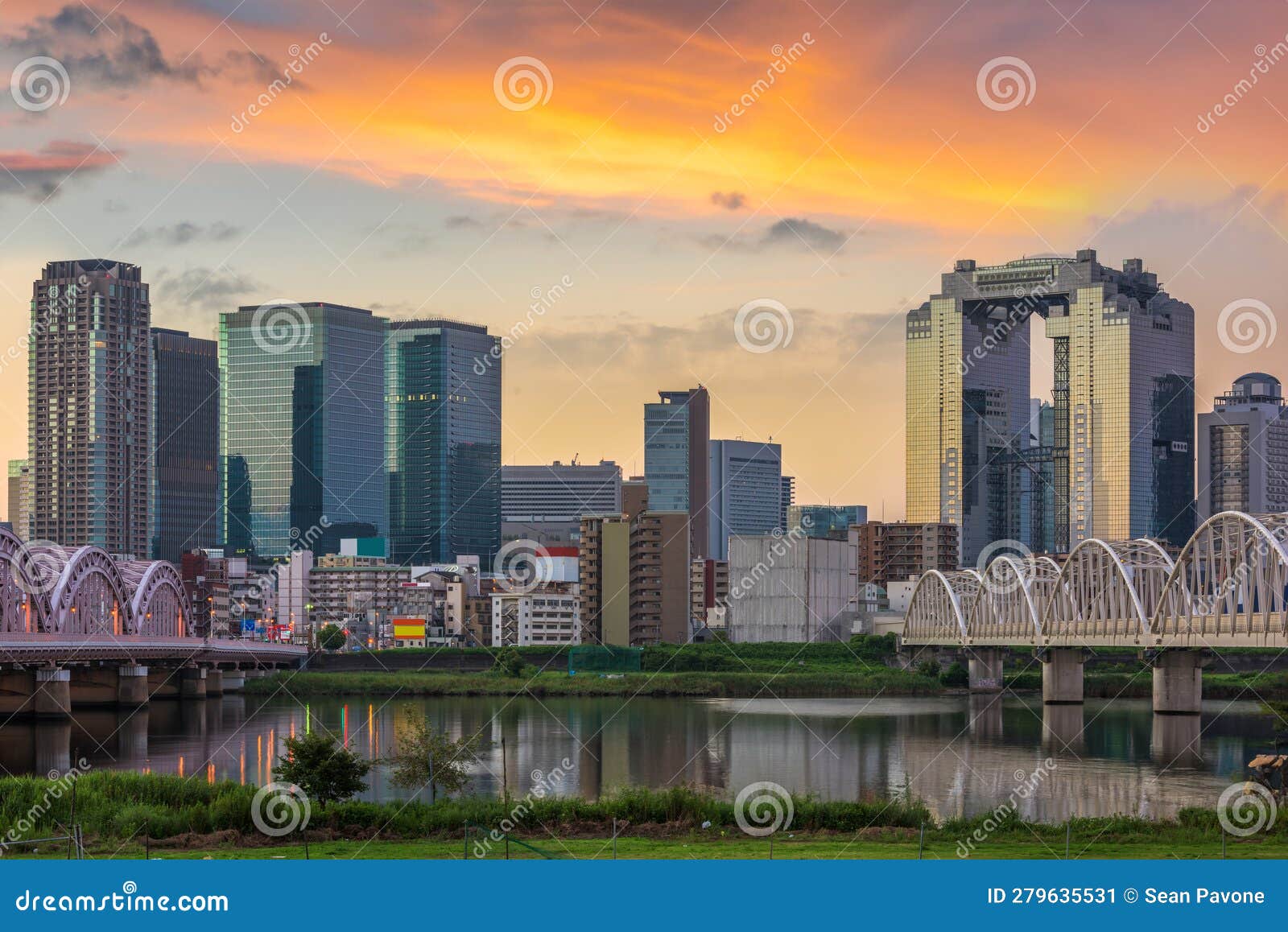 osaka, japan skyline at umeda from across the yodogawa river