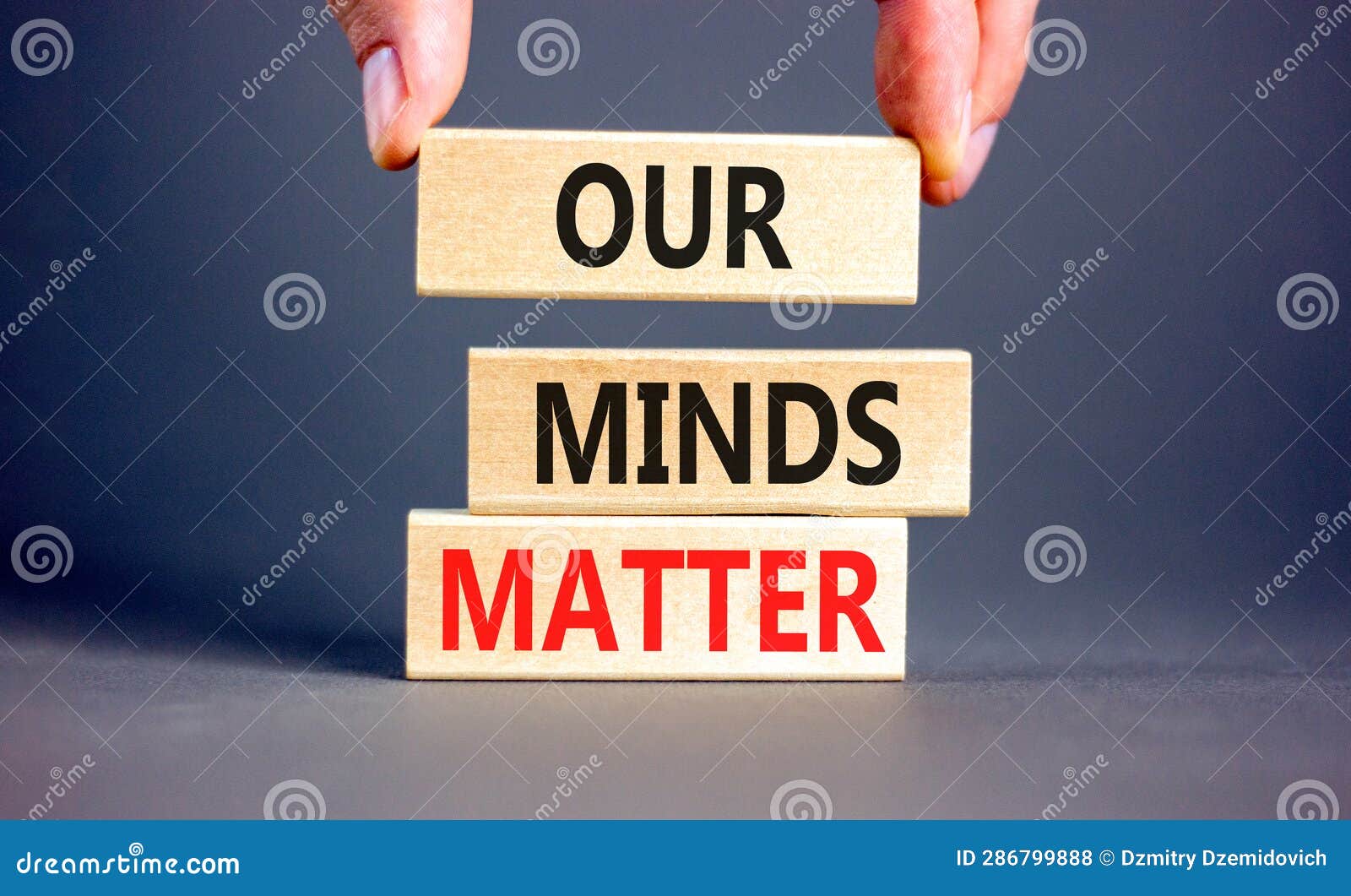 our minds matter ourmindsmatter . concept words our minds matter on wooden block. beautiful grey table grey background.