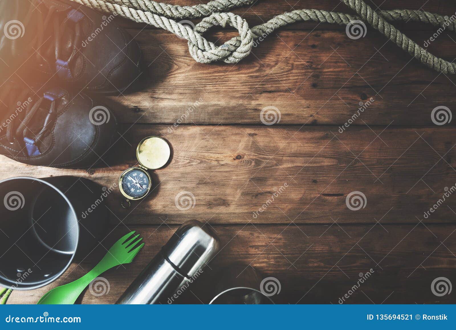 outdoor adventures - expedition camping items on wooden background