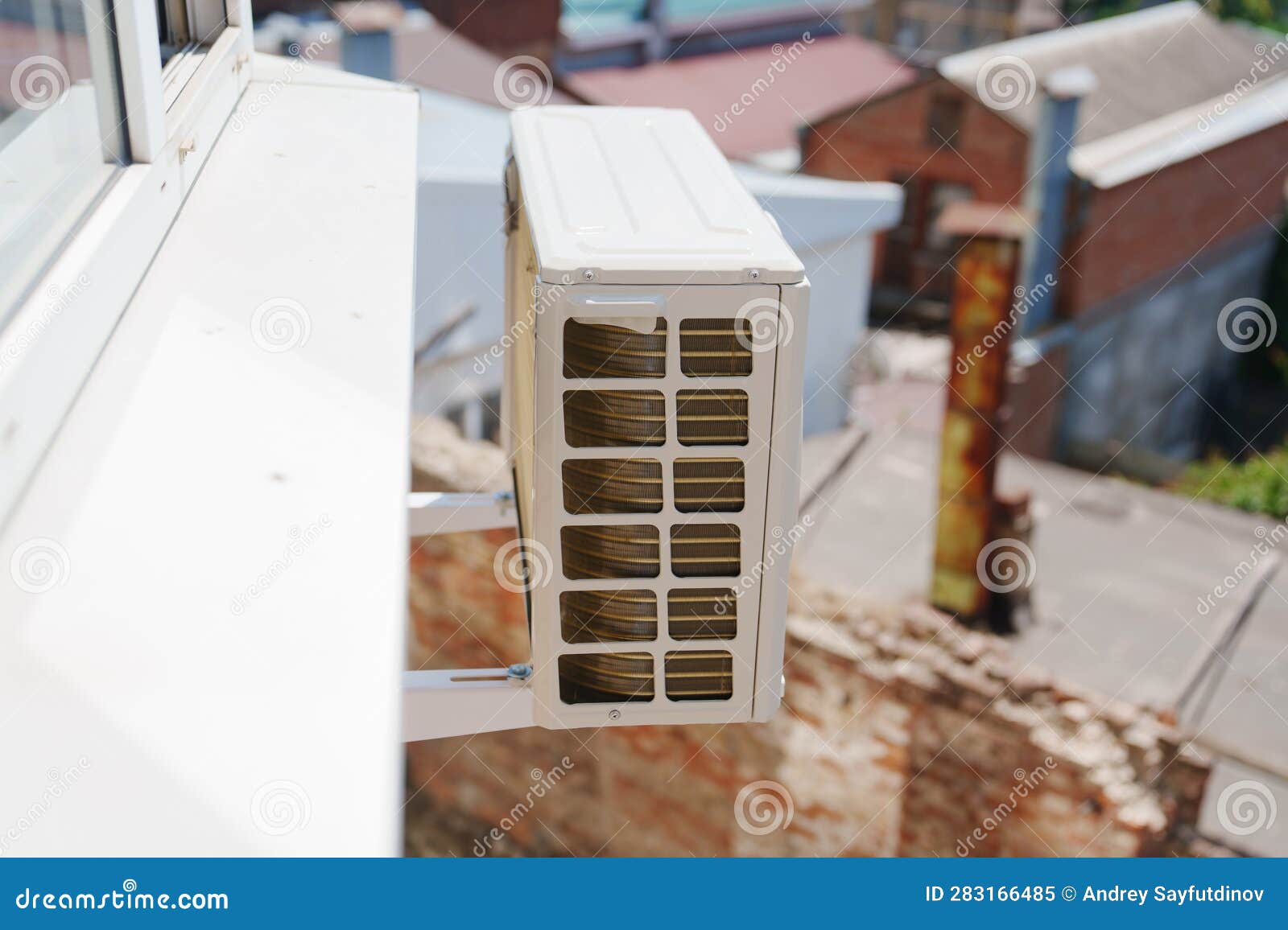 Outdoor Air Conditioning Unit on the Wall of the House Stock Image